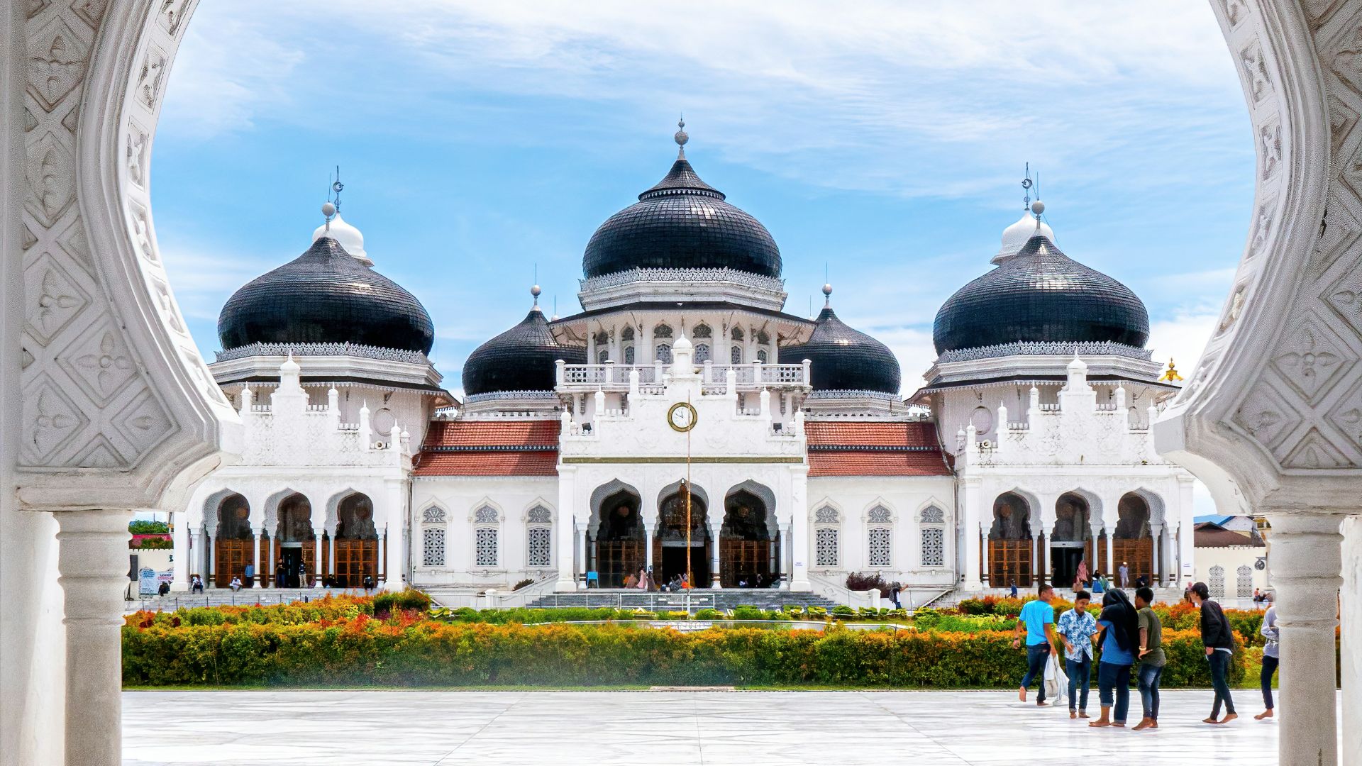 people walking near white concrete building during daytime