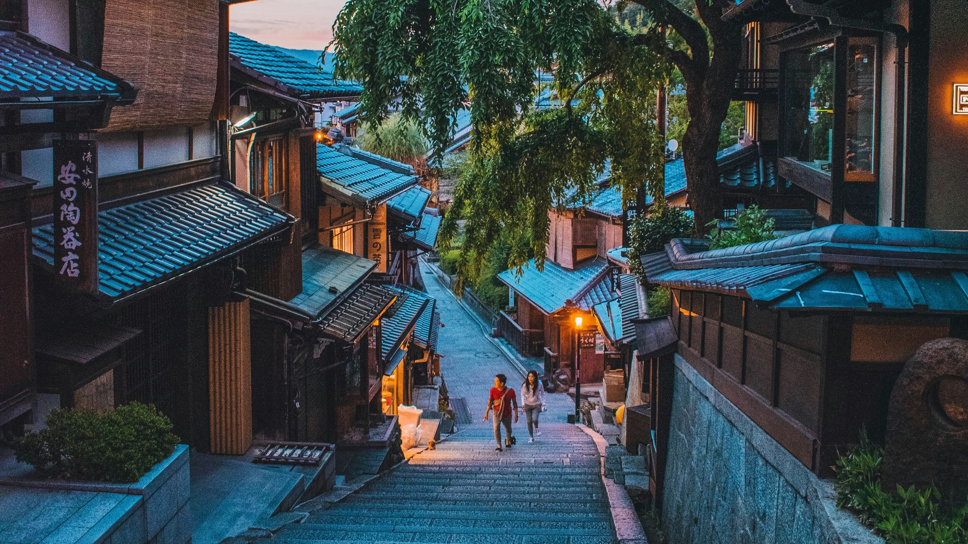 brown wooden house near green trees during daytime
