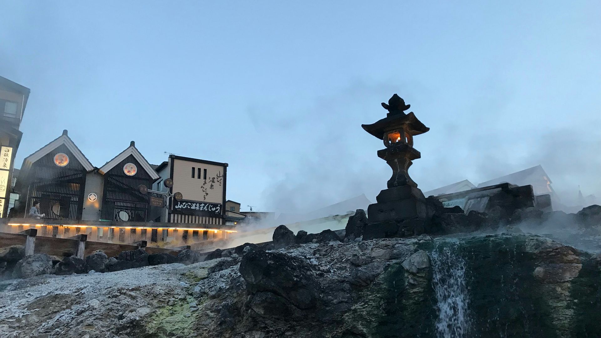 a large building with a fountain in front of it