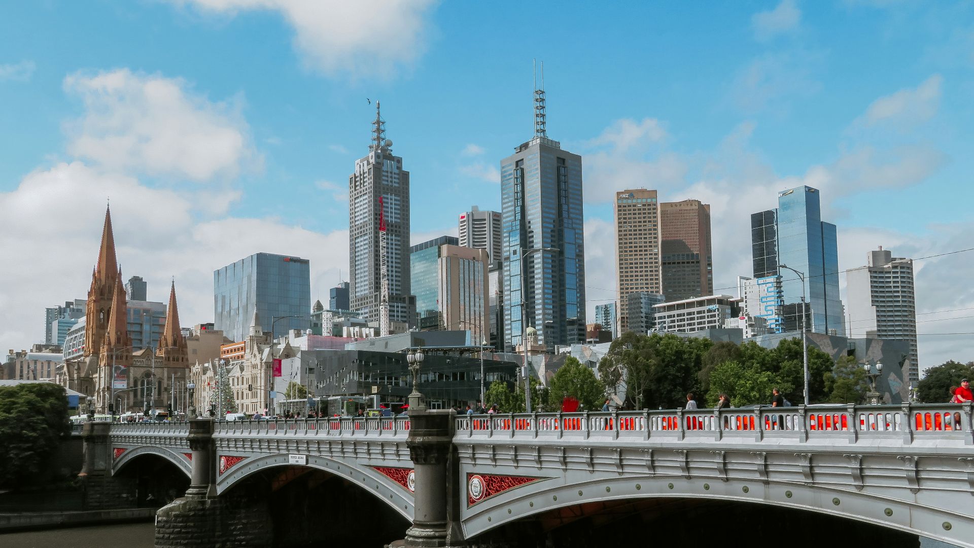 white bridge across city buildings