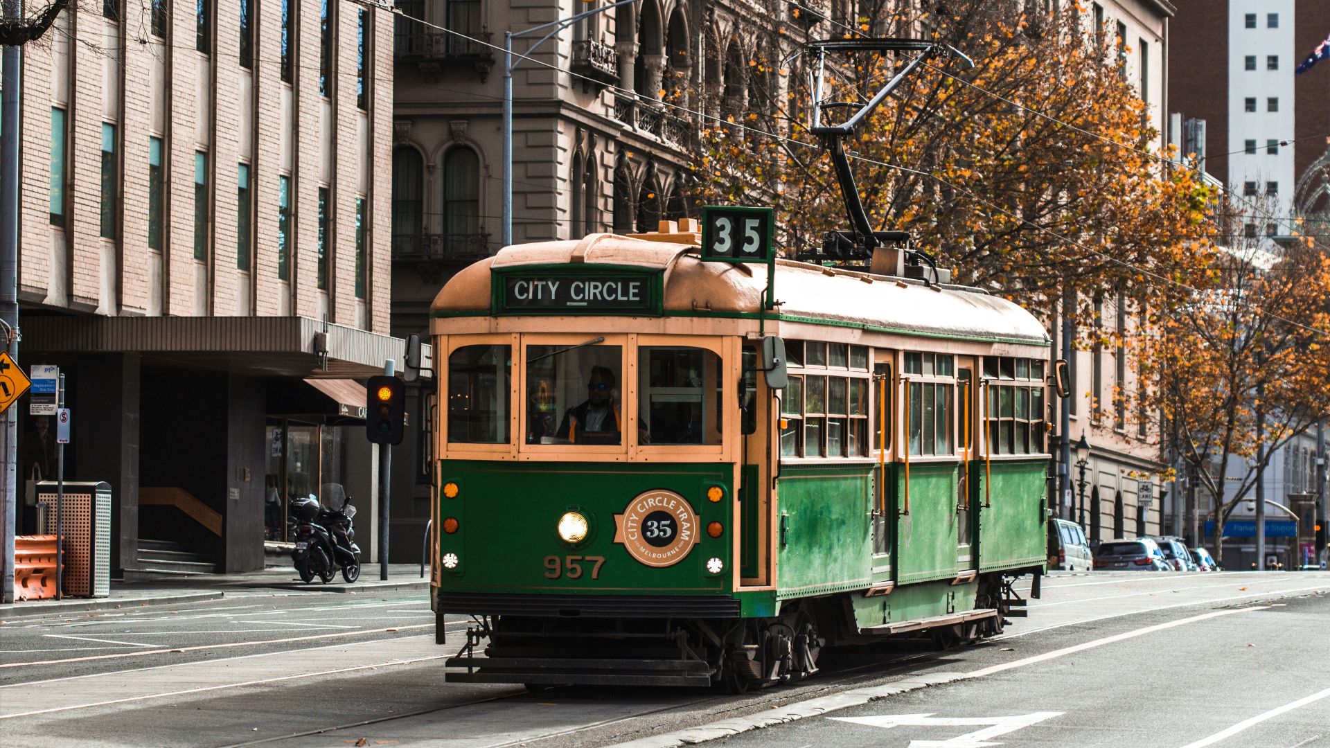 green and yellow tram on road during daytime