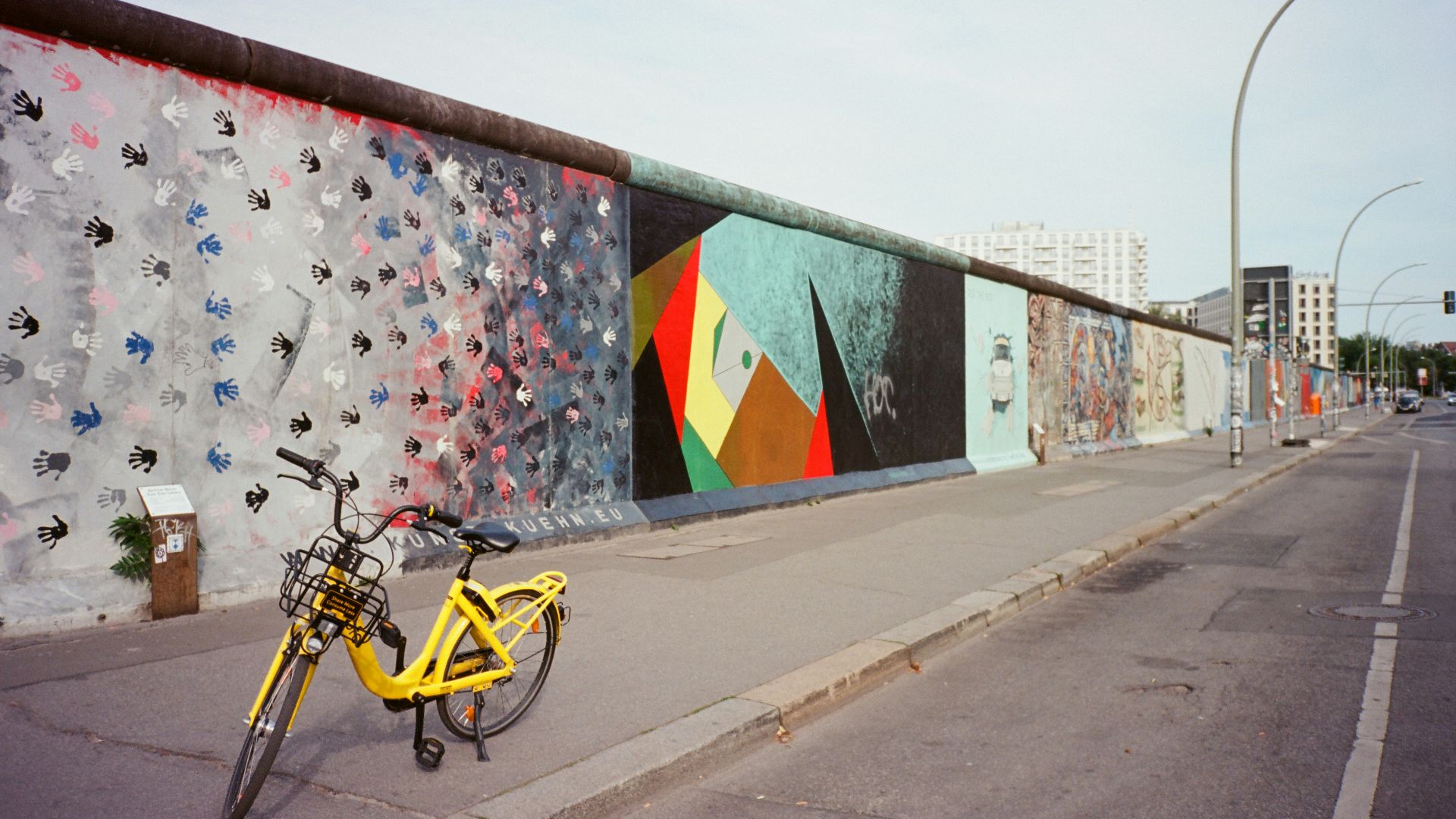 yellow bicycle near wall