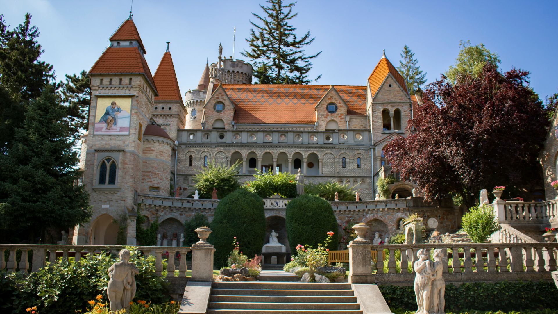 a large building with a garden in front of it