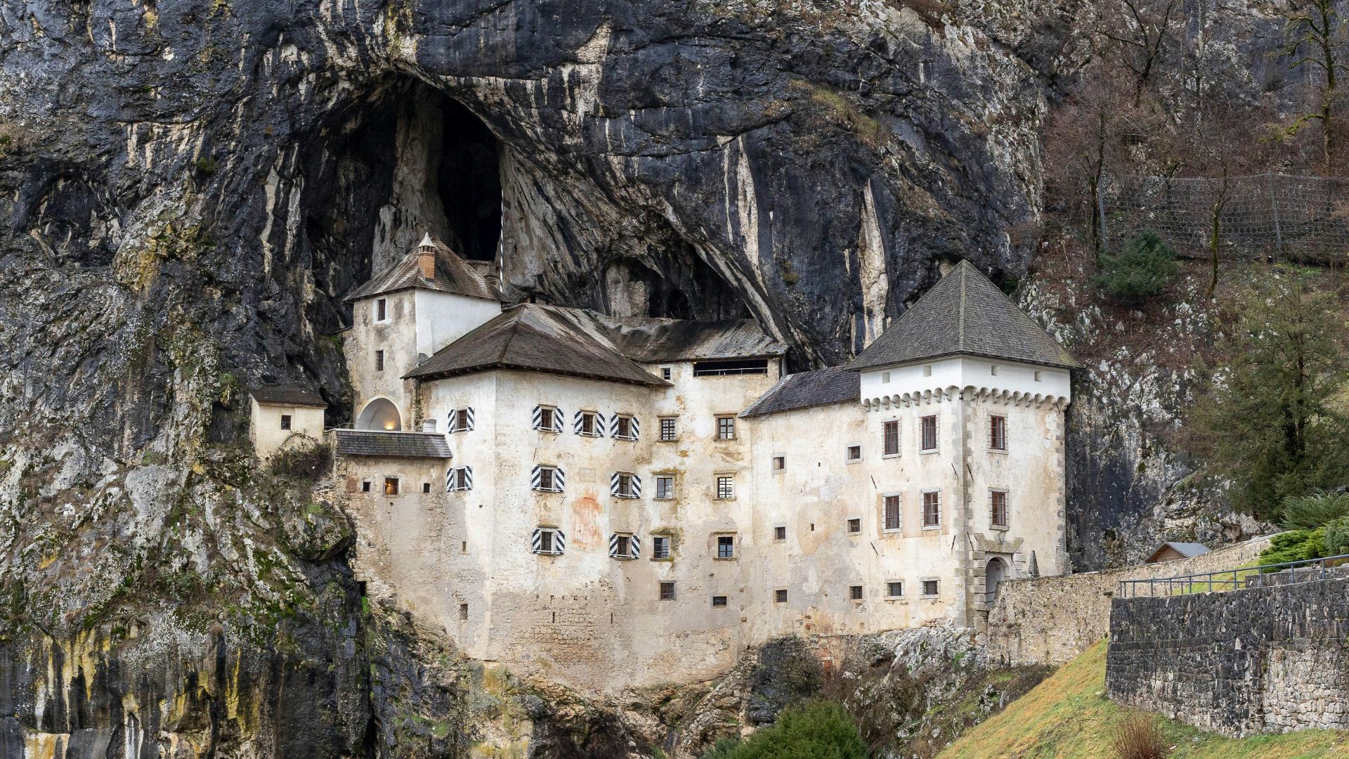 a castle built into the side of a cliff