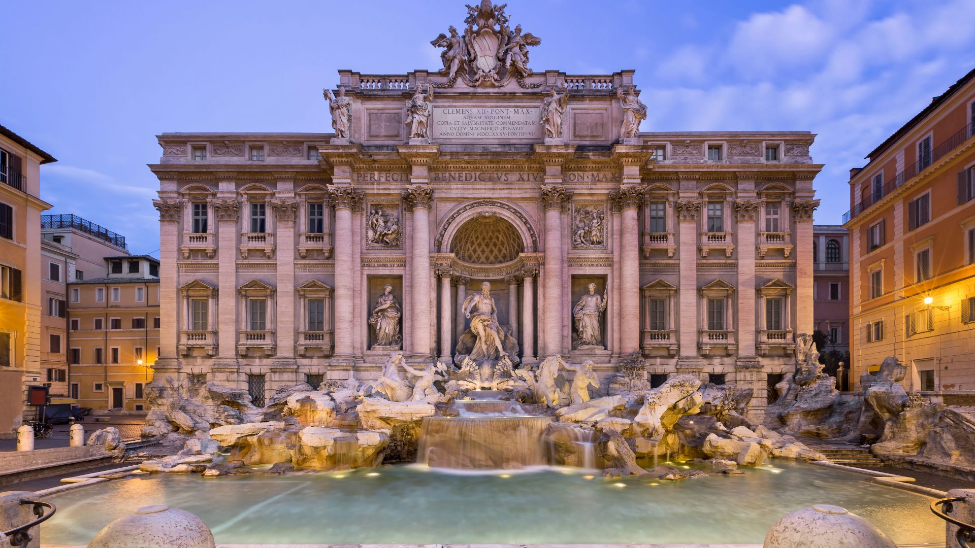 white concrete building with water fountain