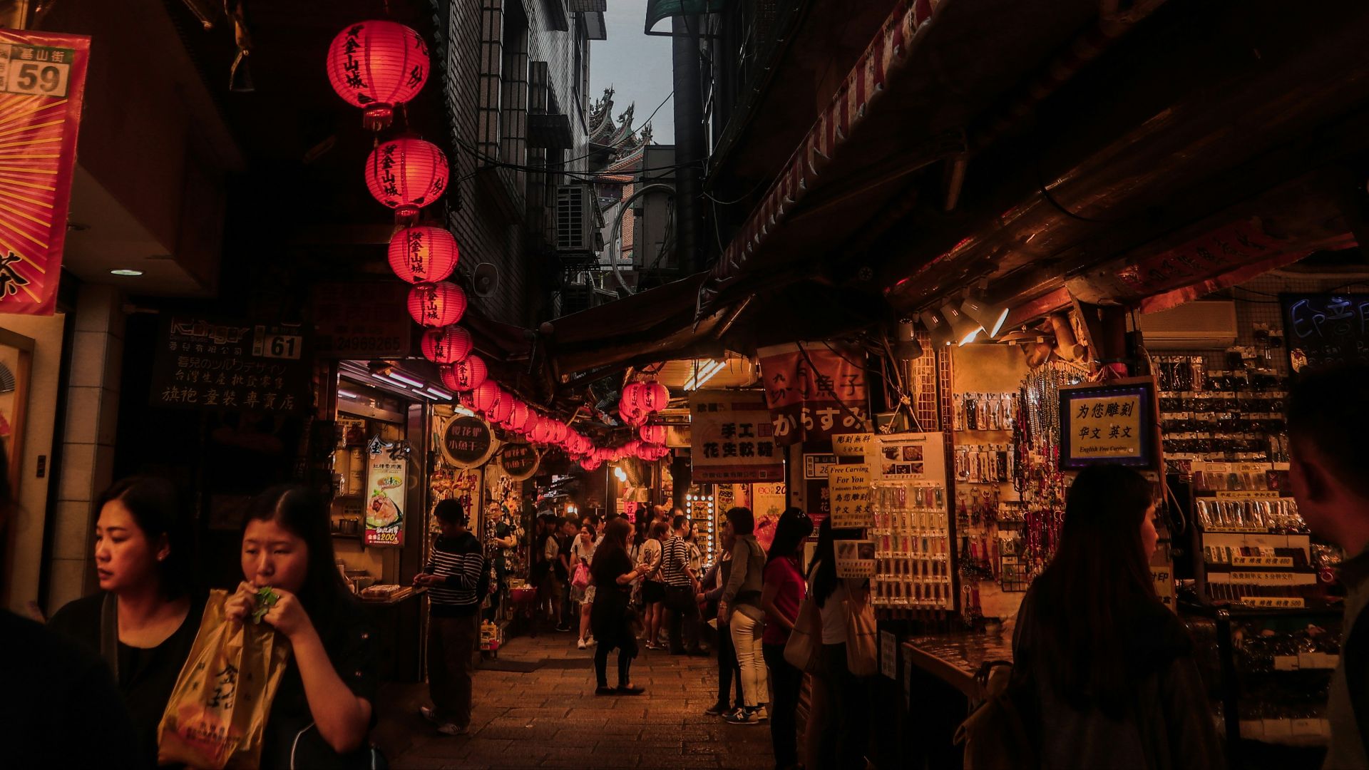 people walking on street during nighttime