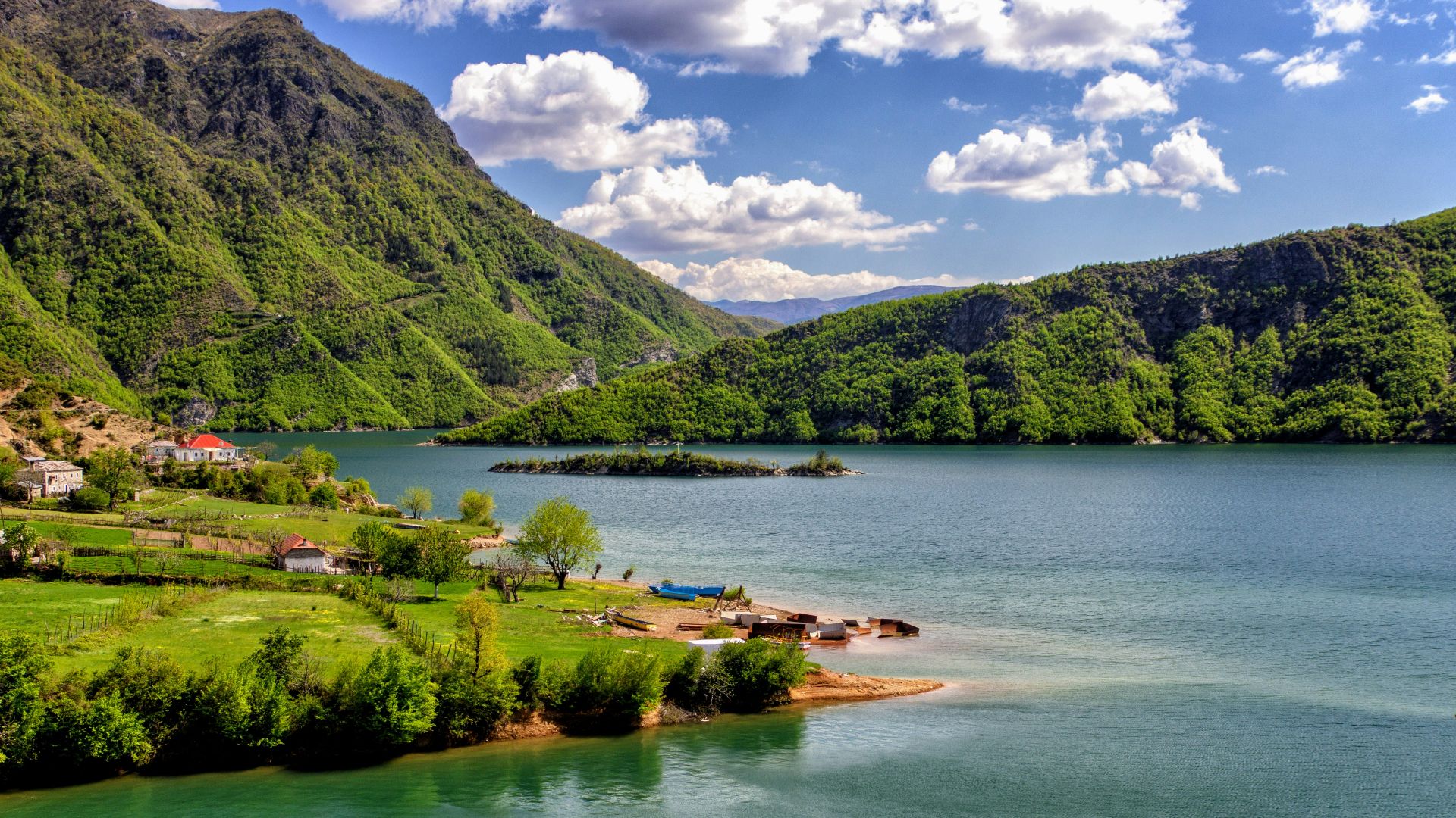 houses near body of water during daytime