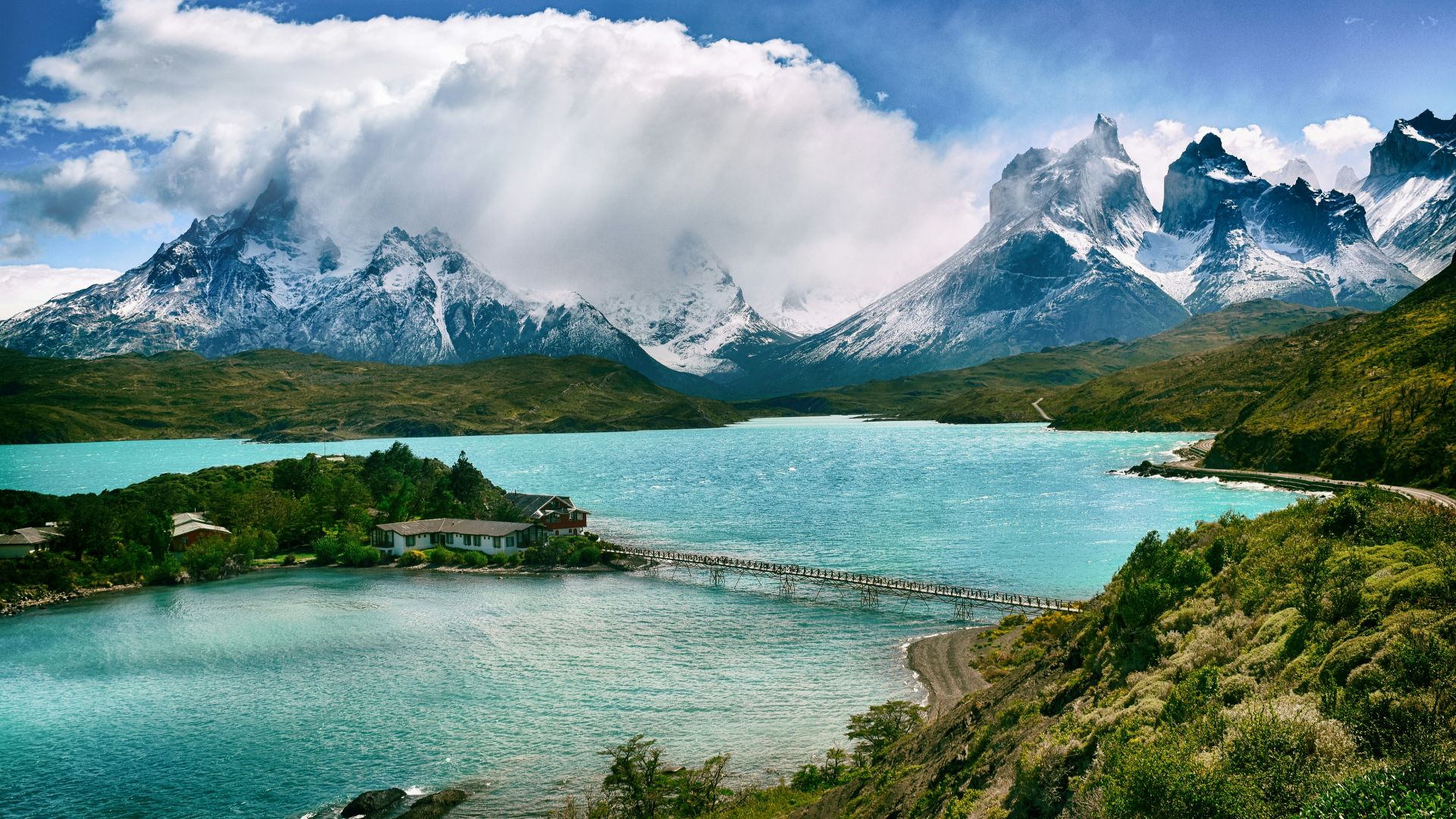 lake near snow-covered mountain during daytime