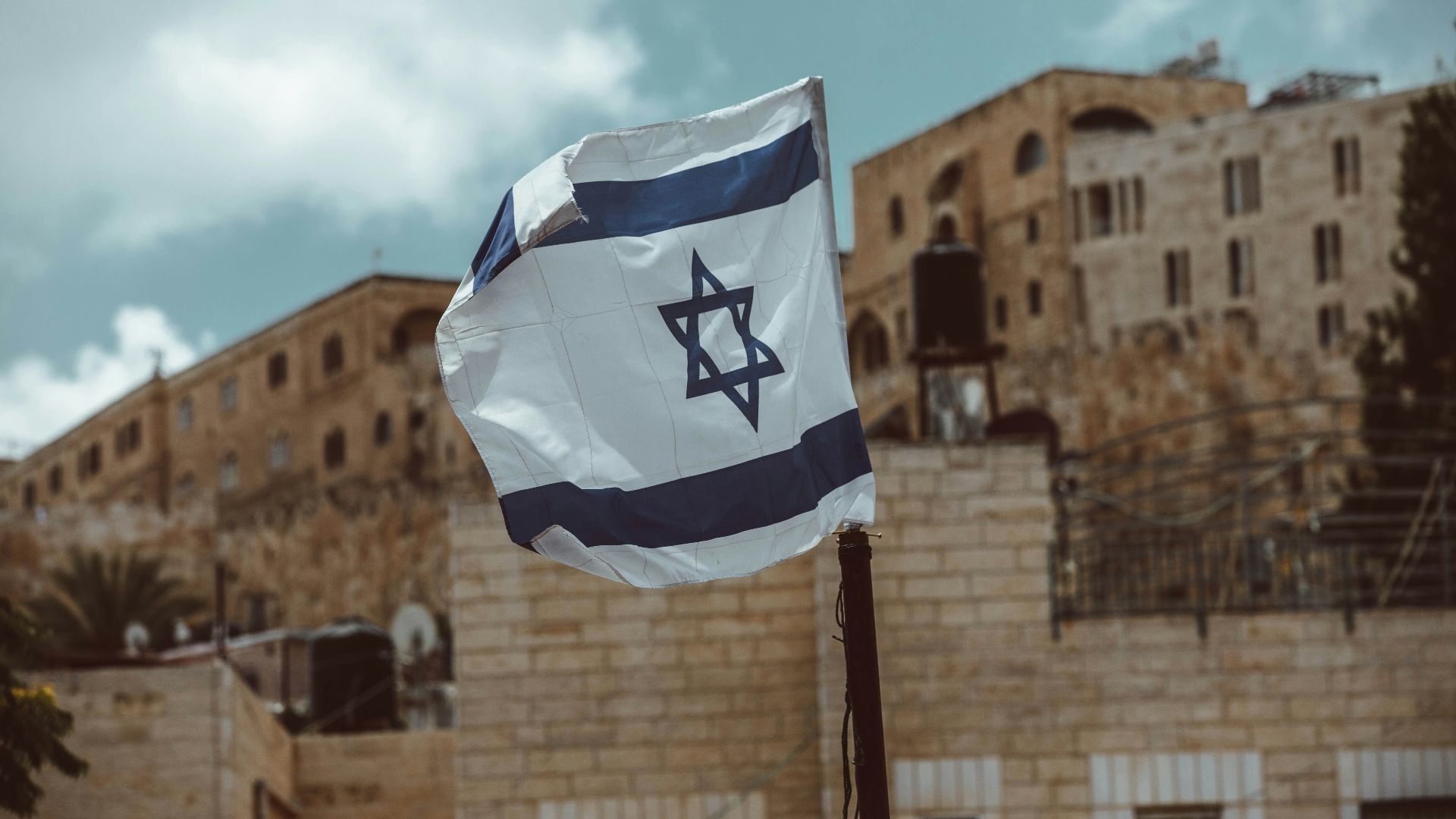 blue and white flag on pole