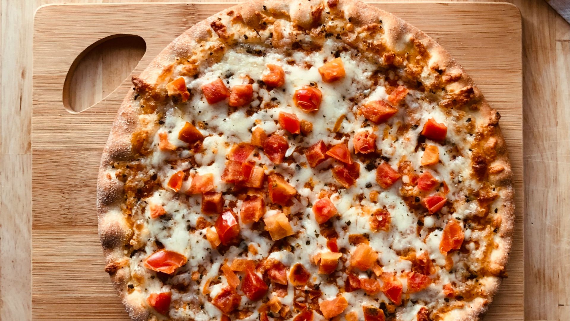 pizza on brown wooden table