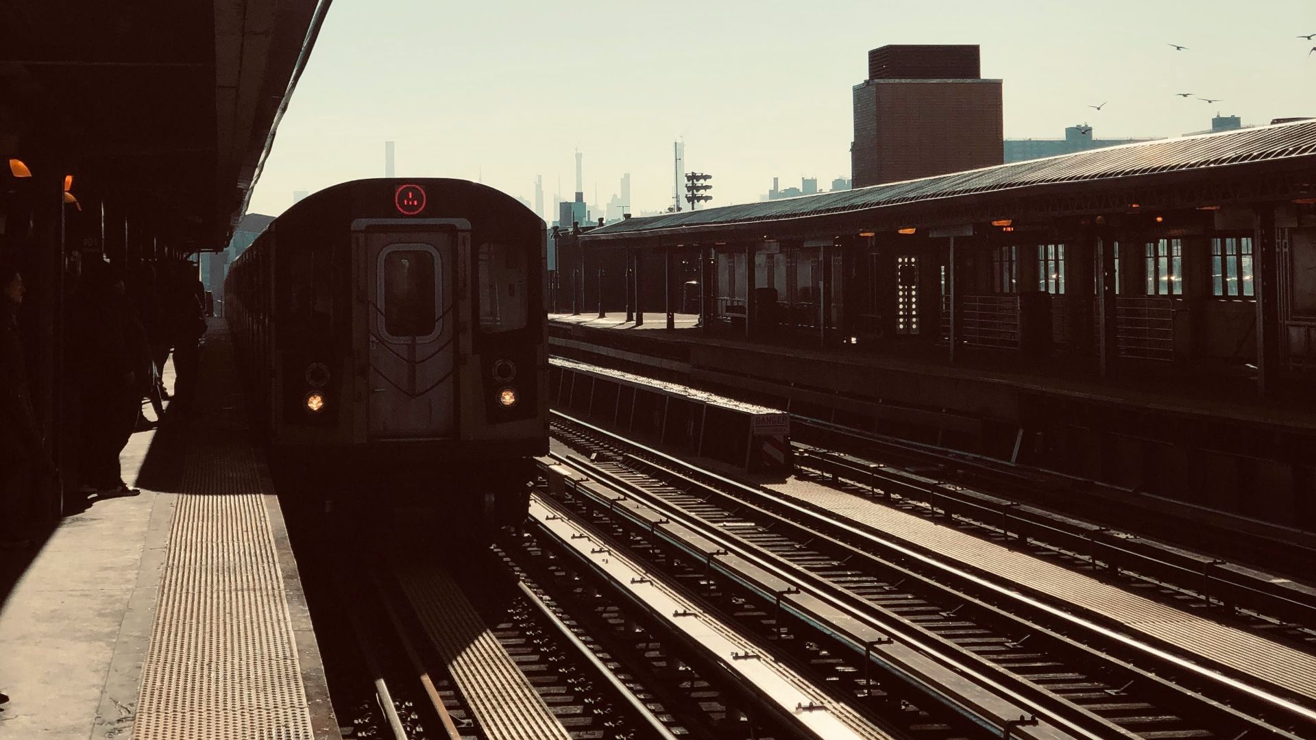 red train on rail road during daytime