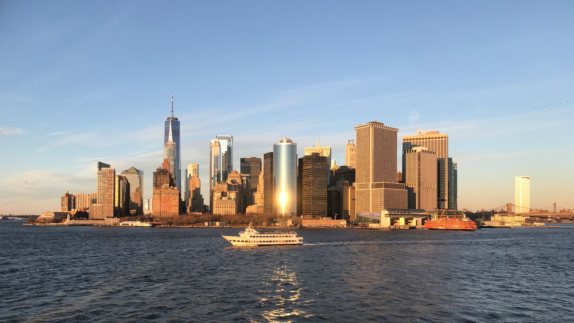 city skyline across body of water during daytime