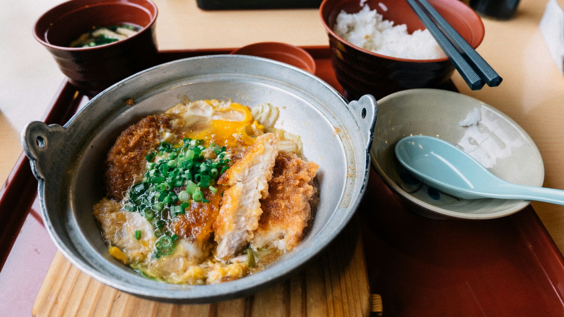 rice with meat and sauce on stainless steel round plate
