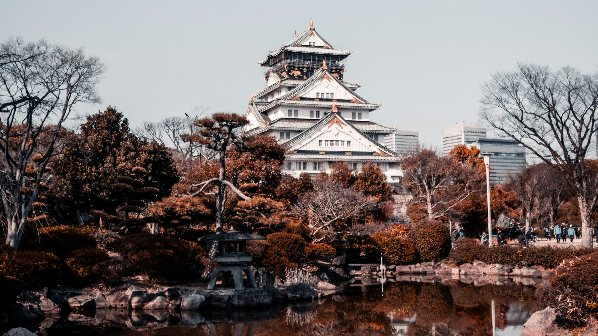 a large white building sitting next to a body of water