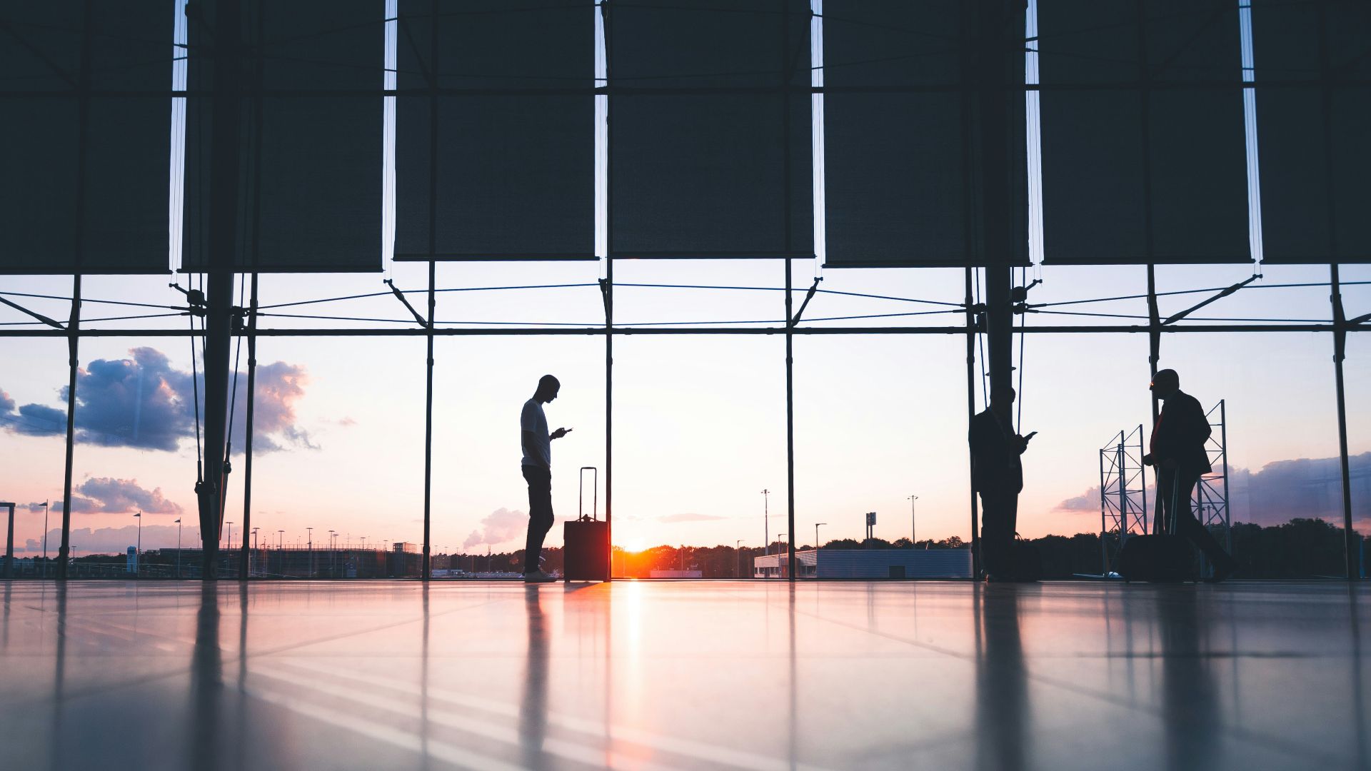 silhouette of person across gray clouds