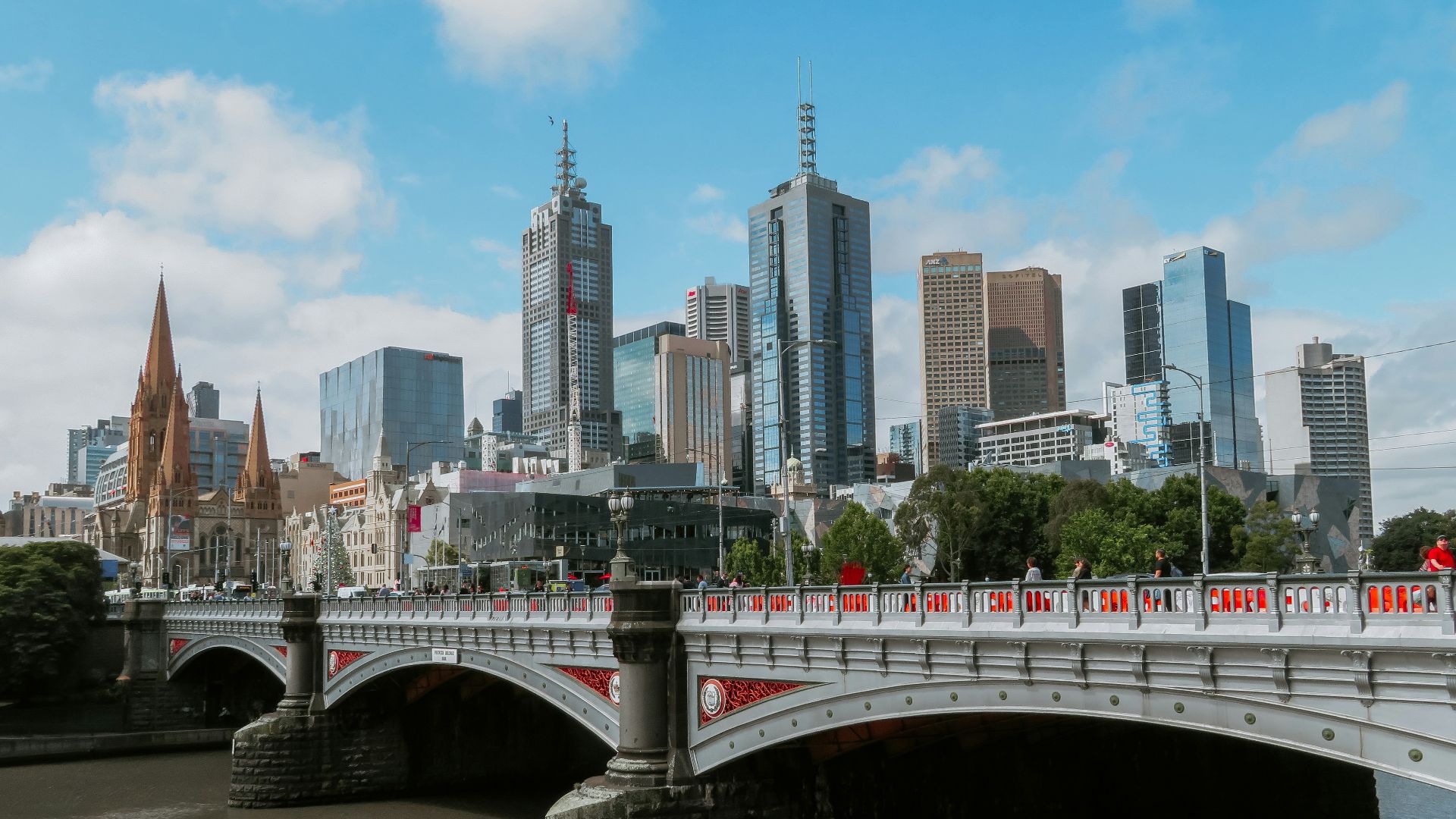 white bridge across city buildings