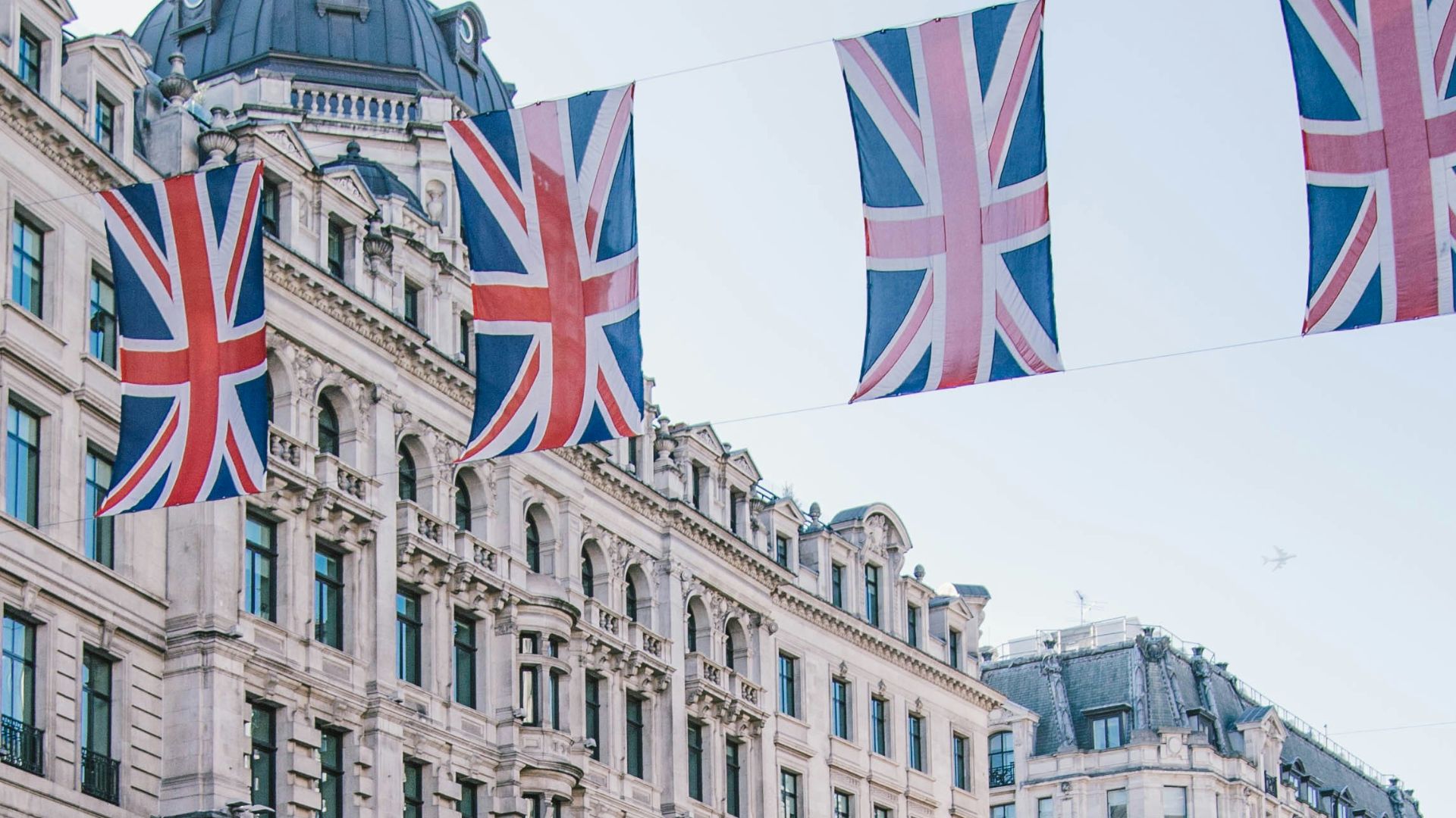 photo of car and bus near castle
