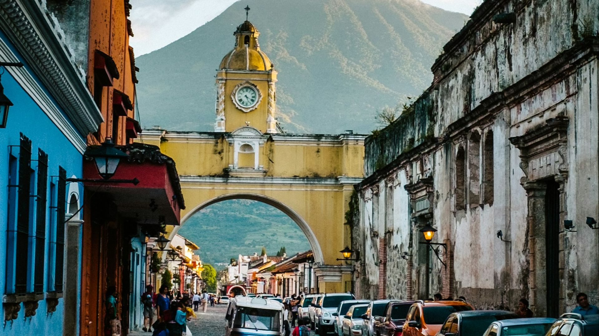 cars parked beside concrete building during daytime