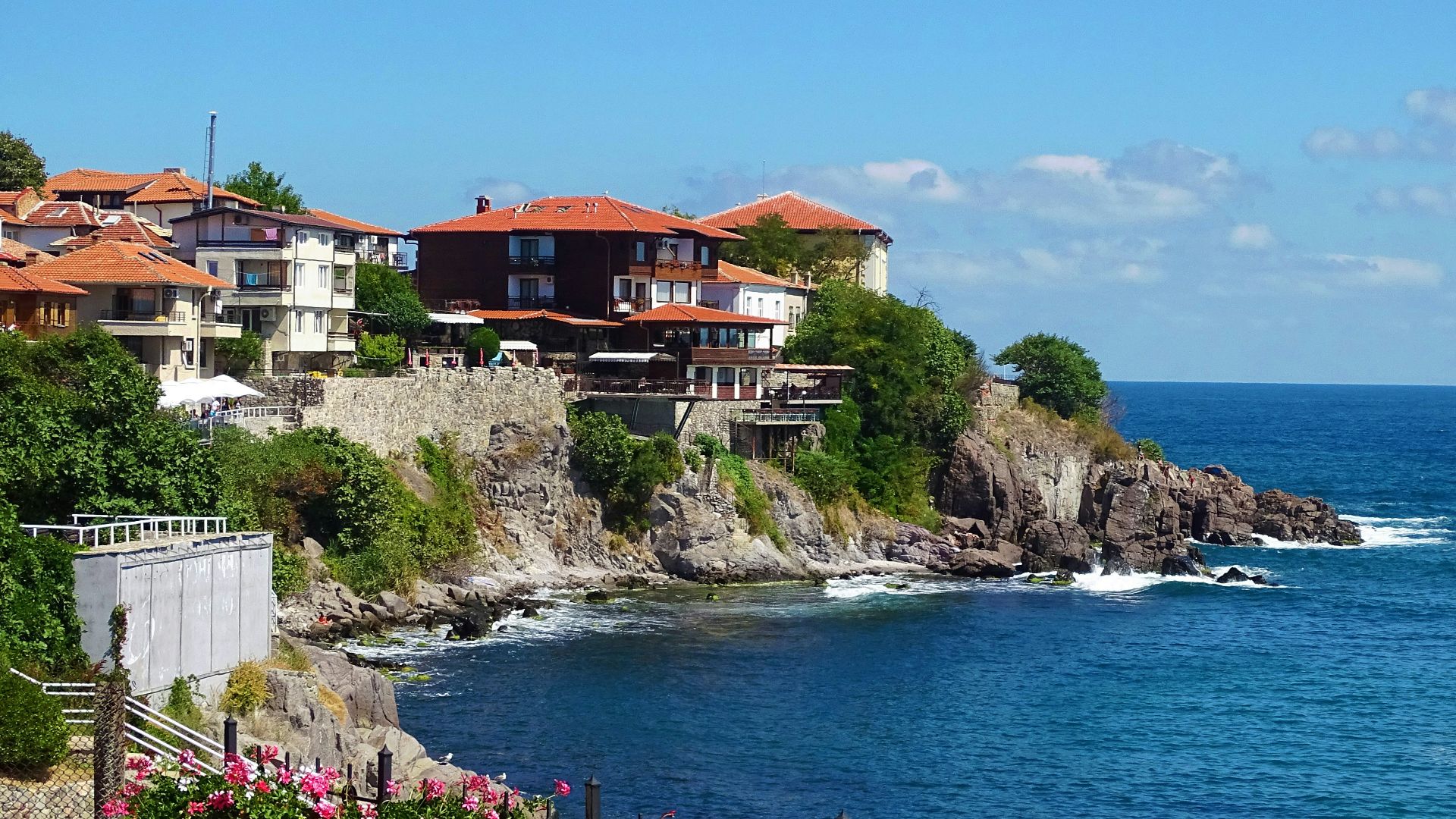 houses near body of water during daytime