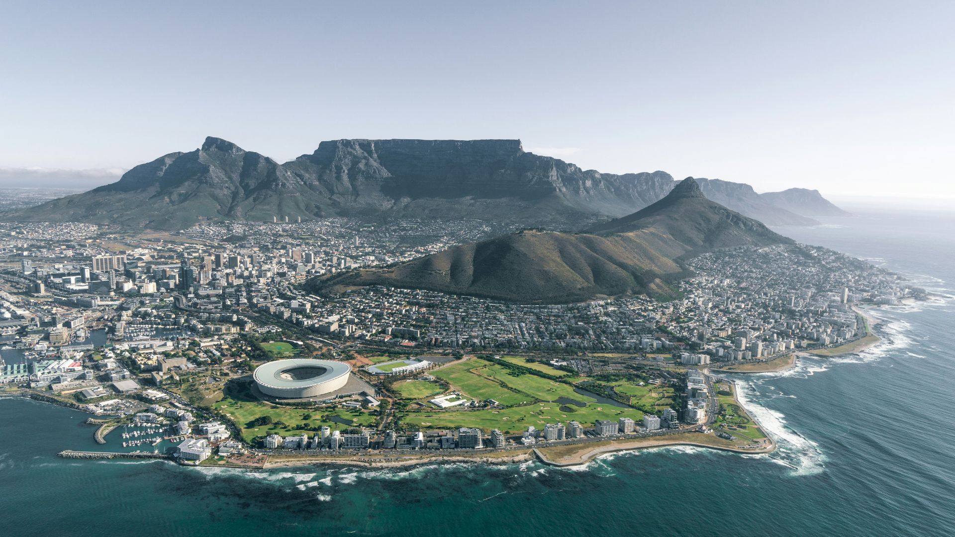 aerial view of city near mountain during daytime
