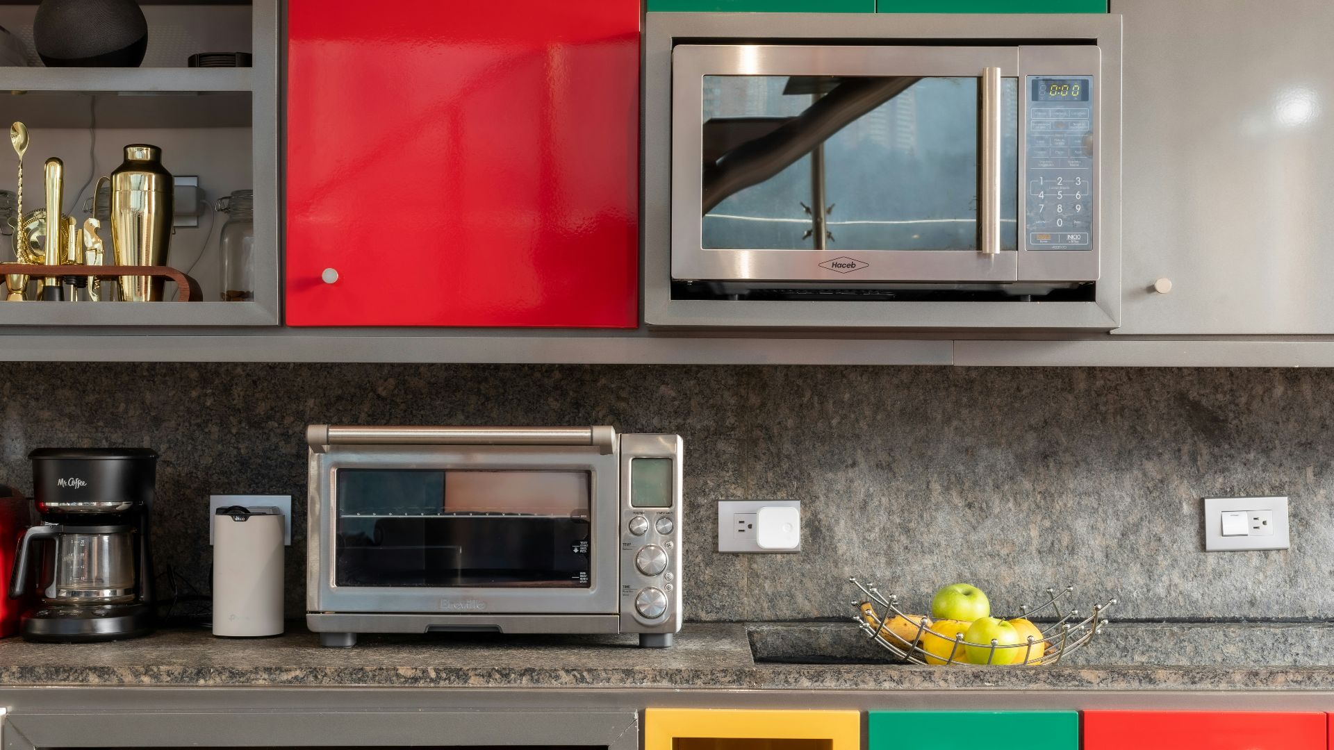 silver microwave oven on black marble counter top