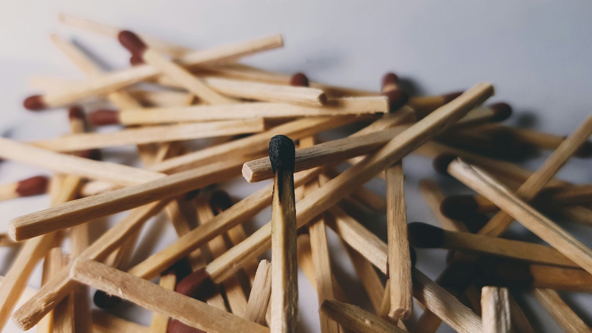 brown wooden sticks on white surface