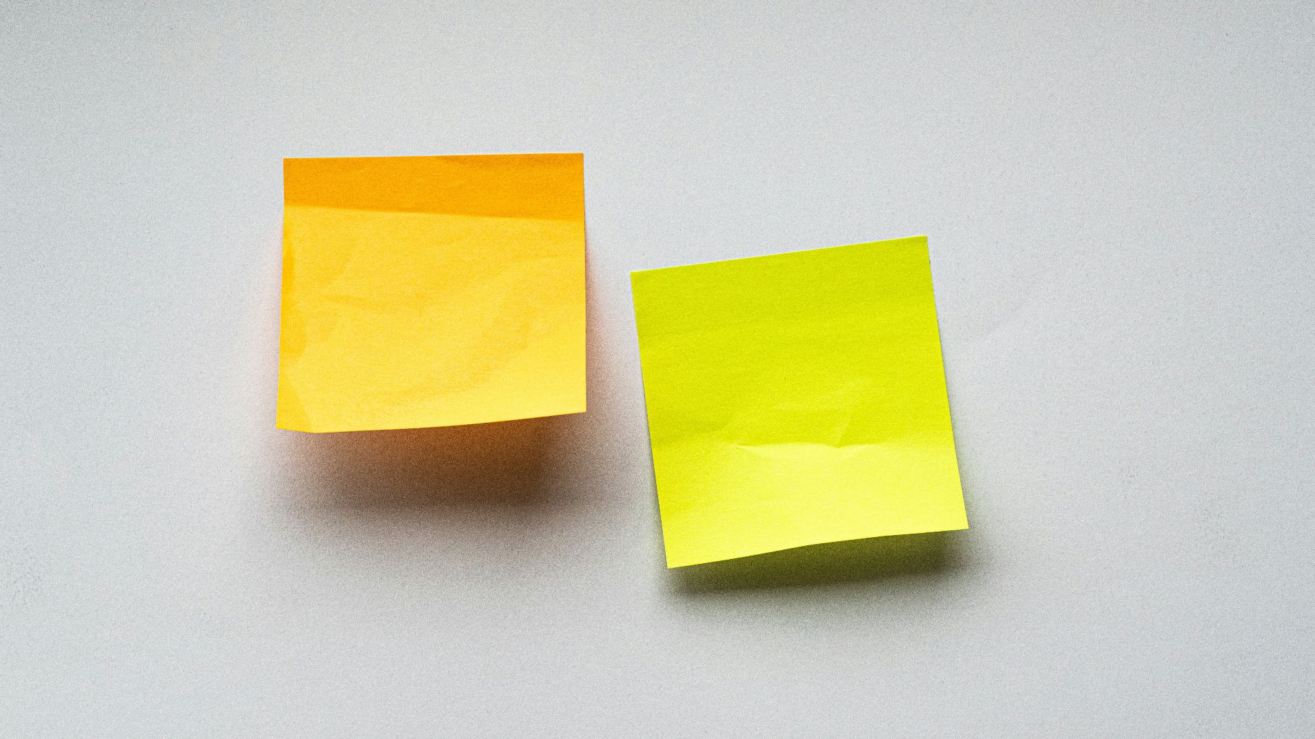 yellow sticky notes on white wall