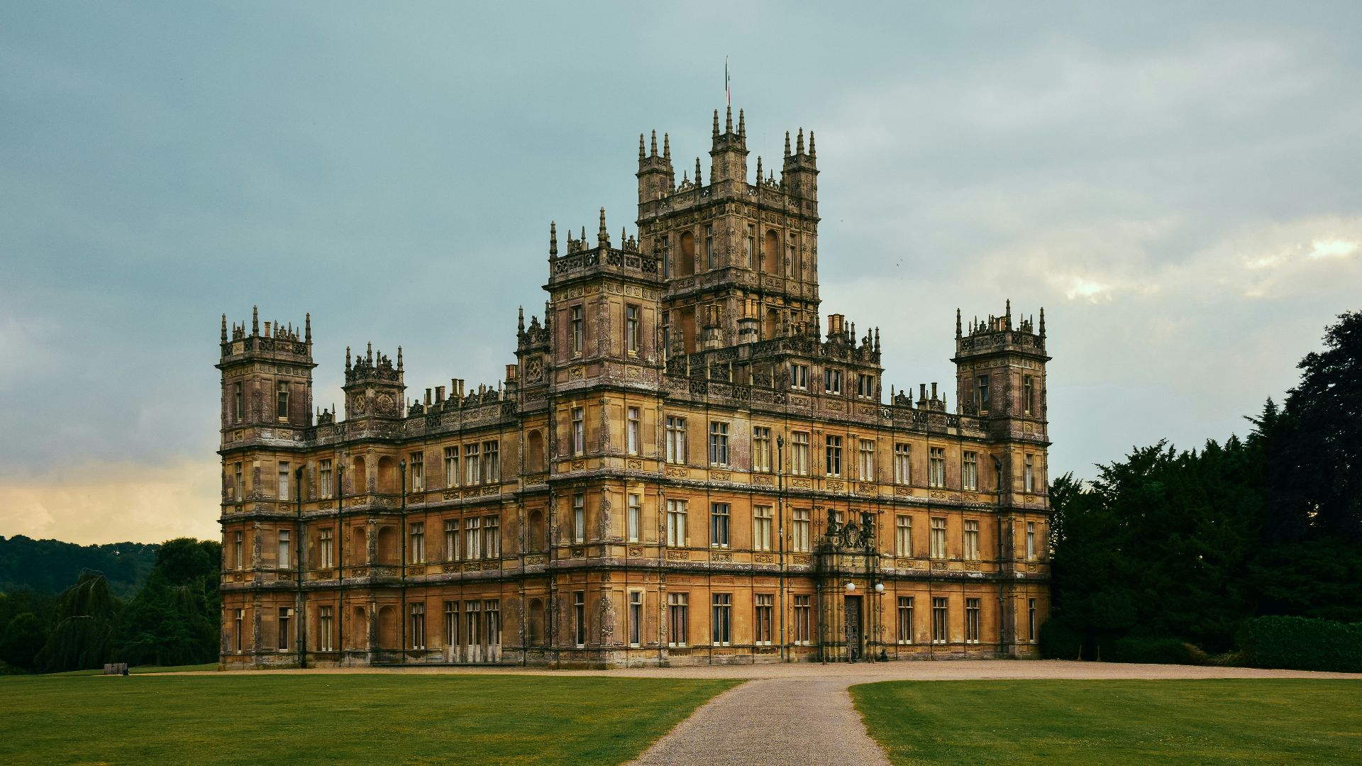 brown concrete building under white clouds during daytime