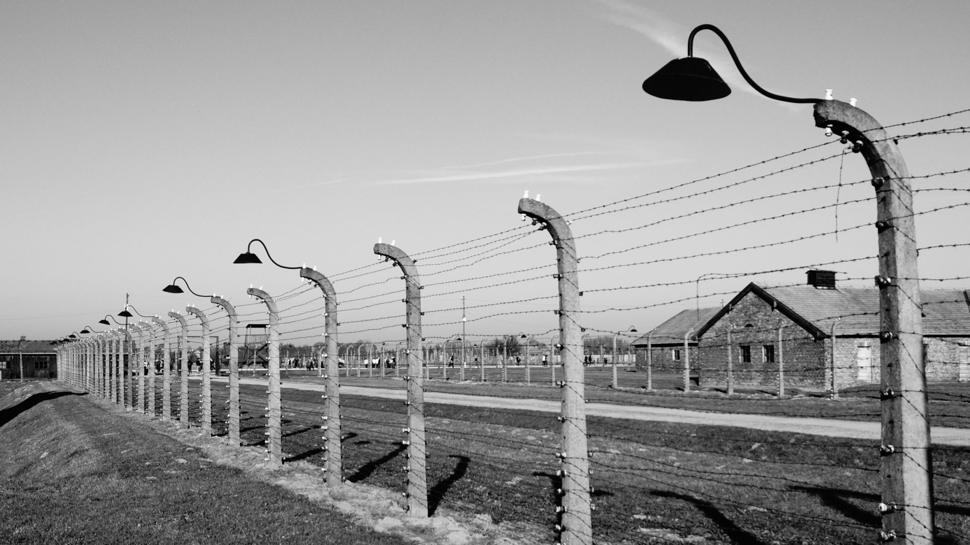 grayscale photo of wooden fence