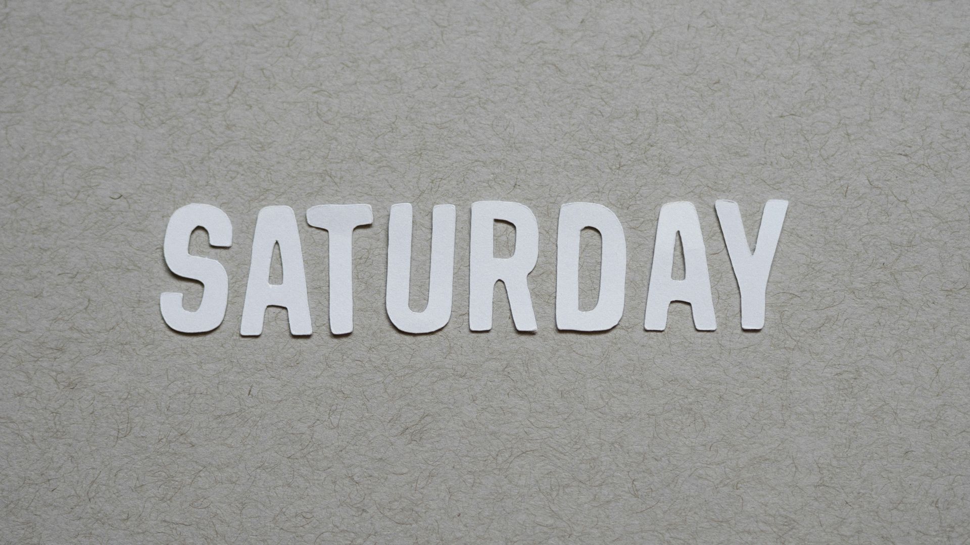 the word saturday written in cut out letters