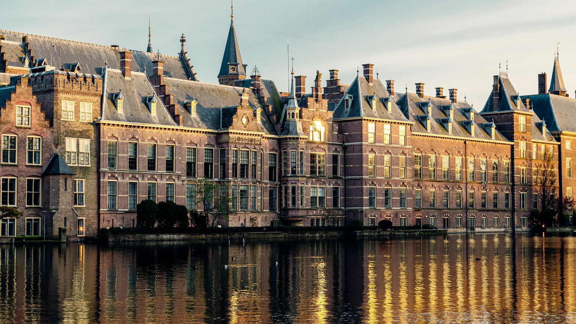 a large building sitting on top of a lake