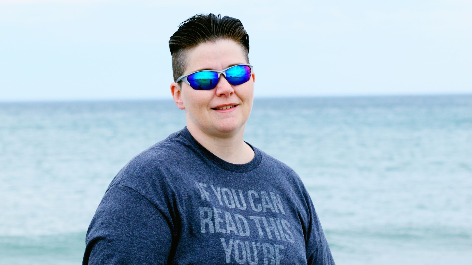 man in gray crew neck shirt wearing aviator sunglasses