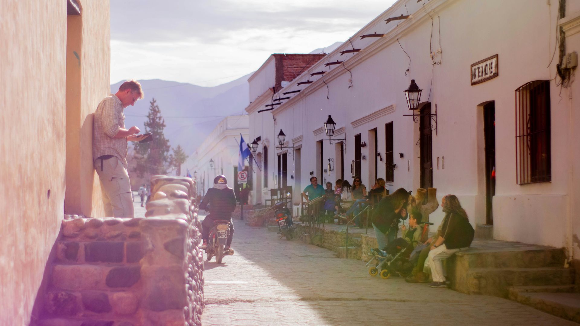 people sitting on chair near building during daytime