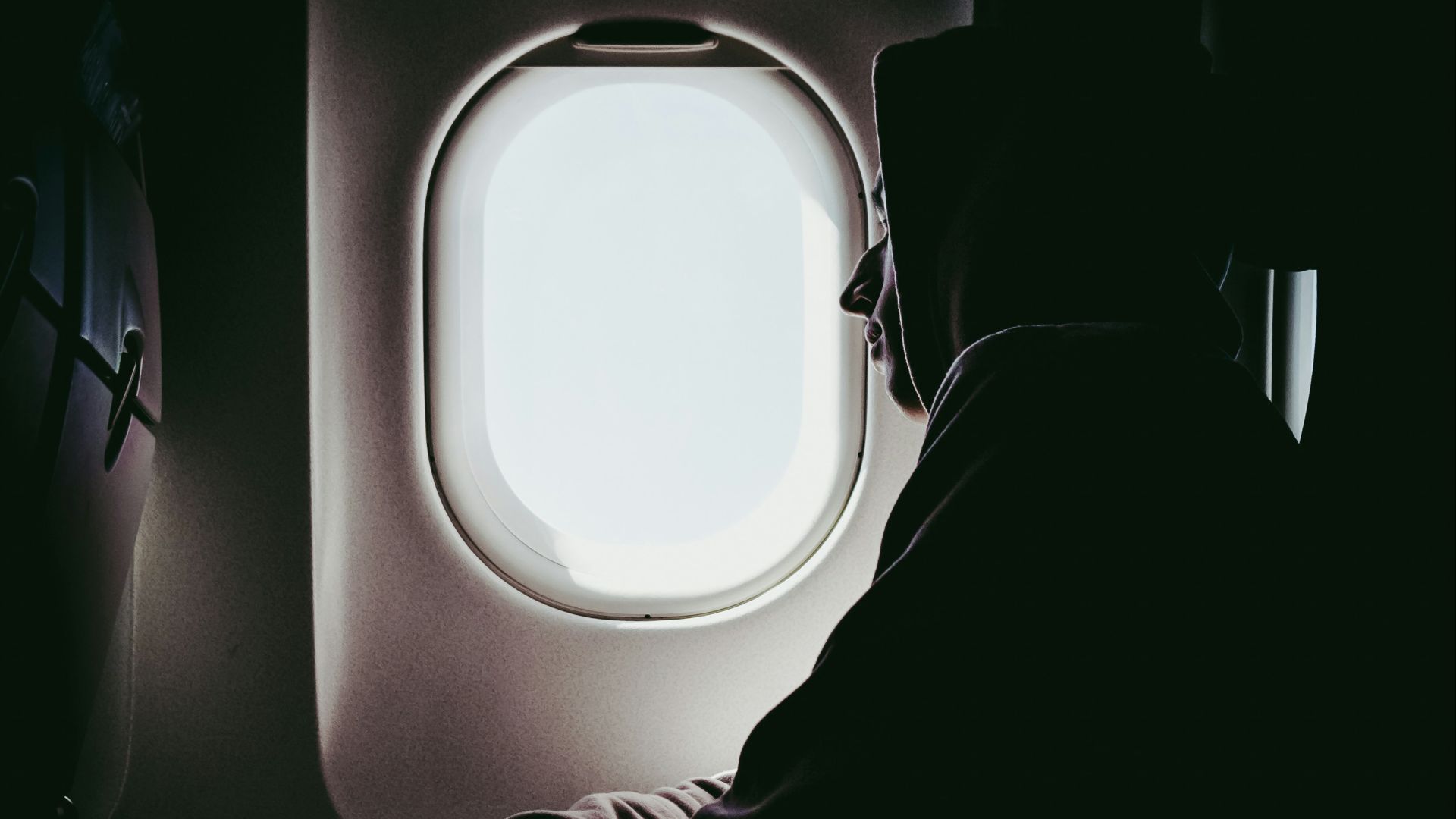 man looking at window