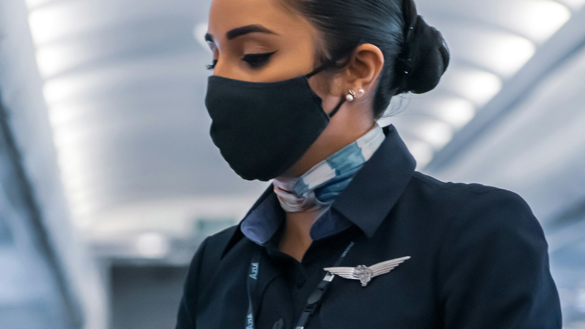 man in black suit jacket wearing mask
