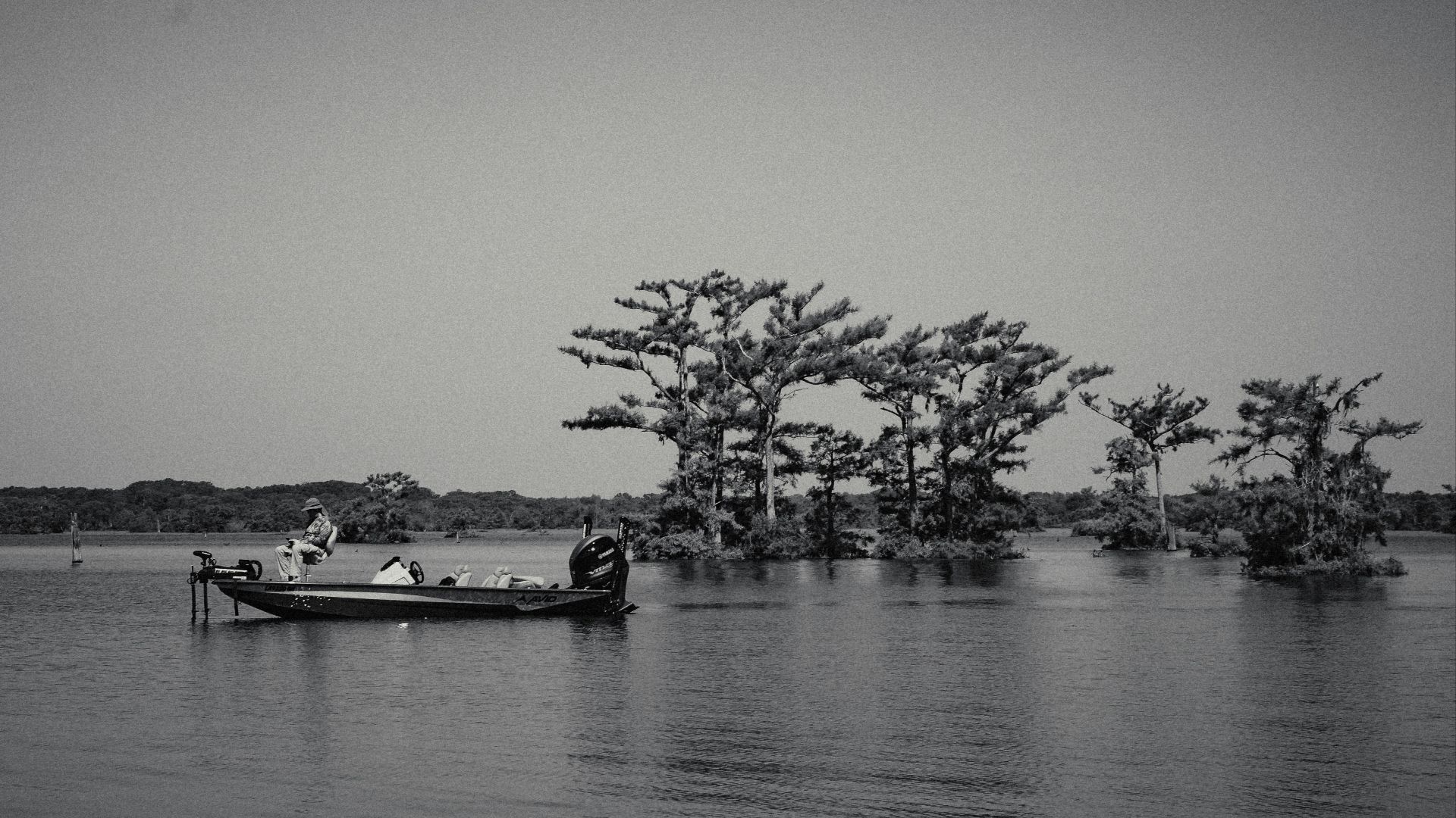A boat floating on top of a large body of water