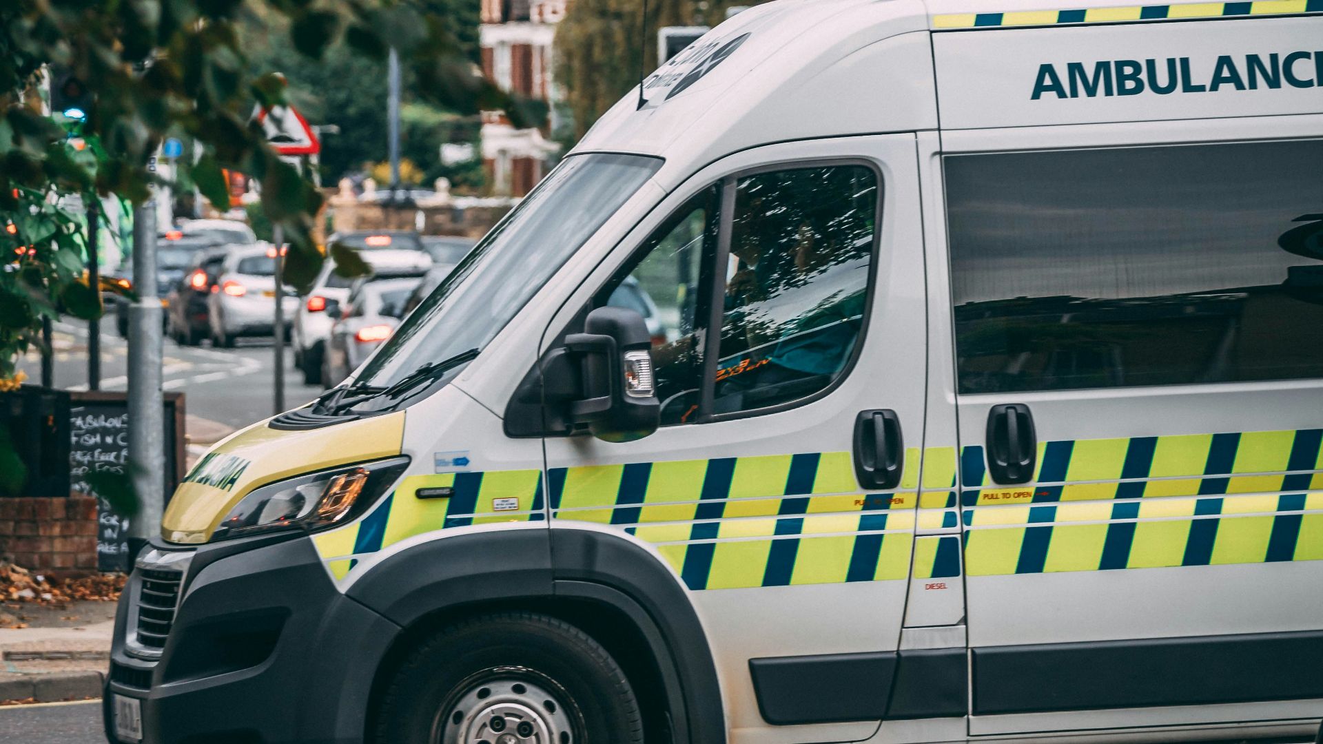 white and blue police car on road during daytime