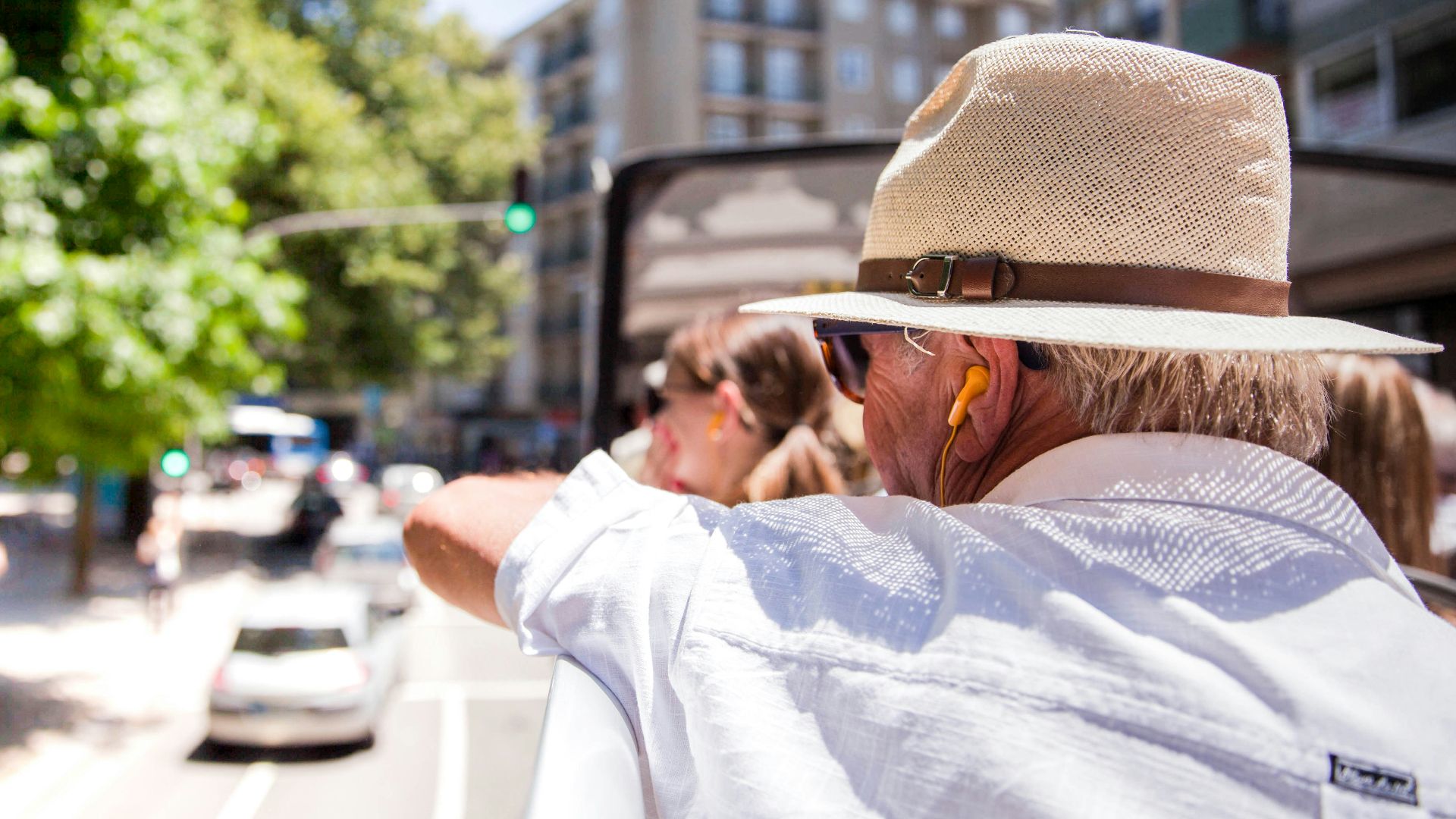 man in white dress shirt and brown fedora hat