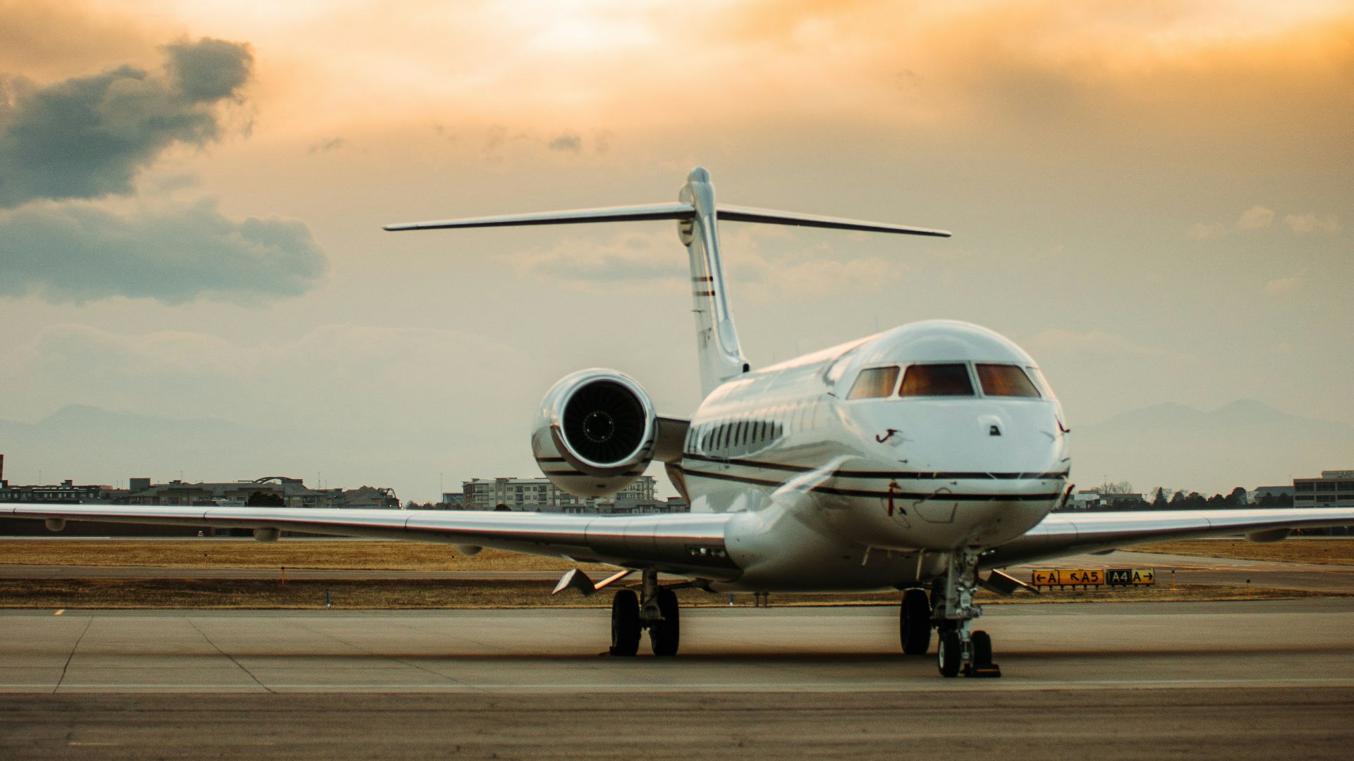 white airplane on airport during daytime