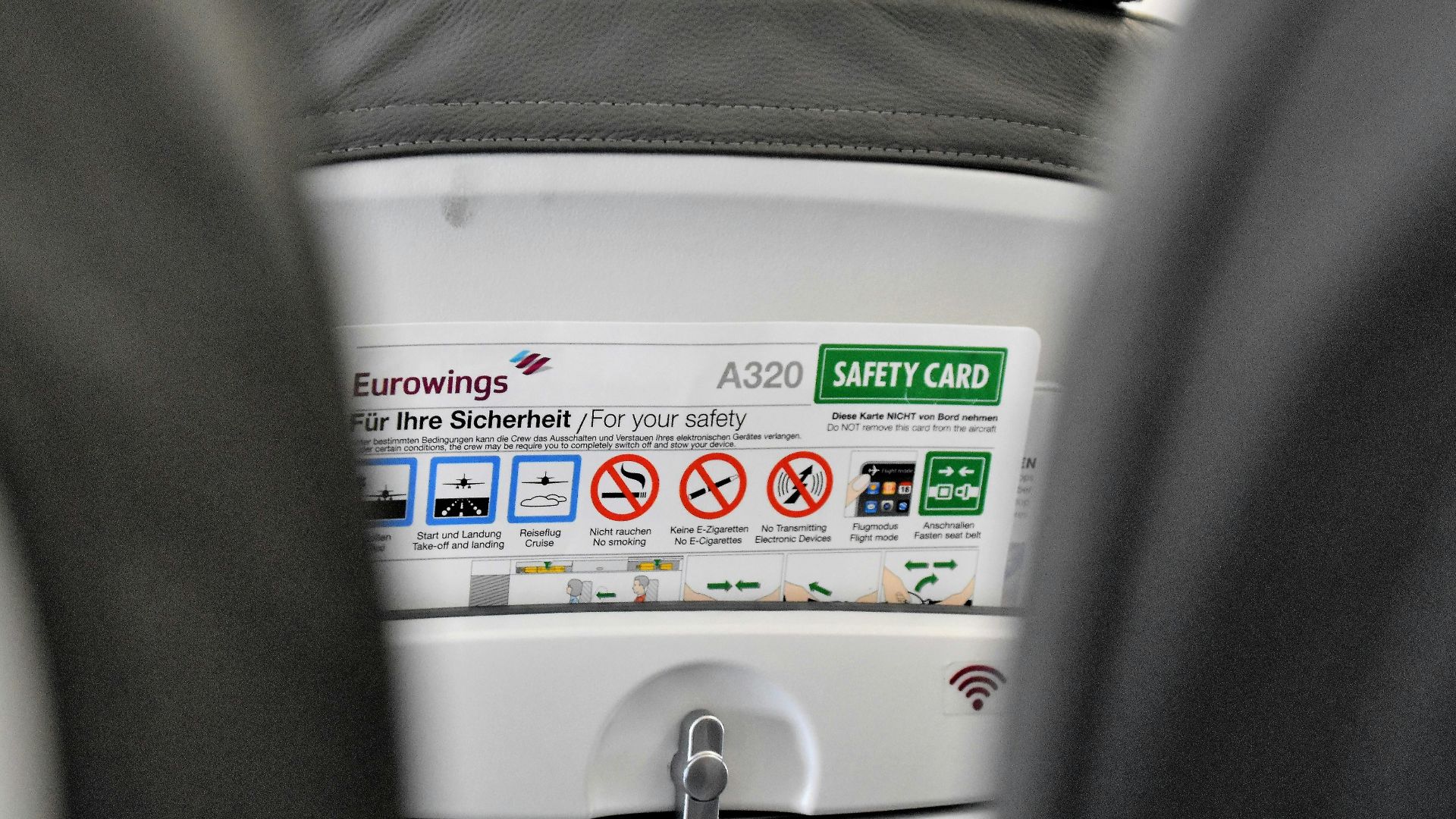 a close up of a seat with a button on it