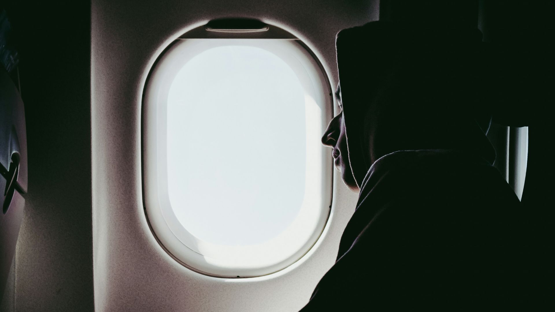 man looking at window