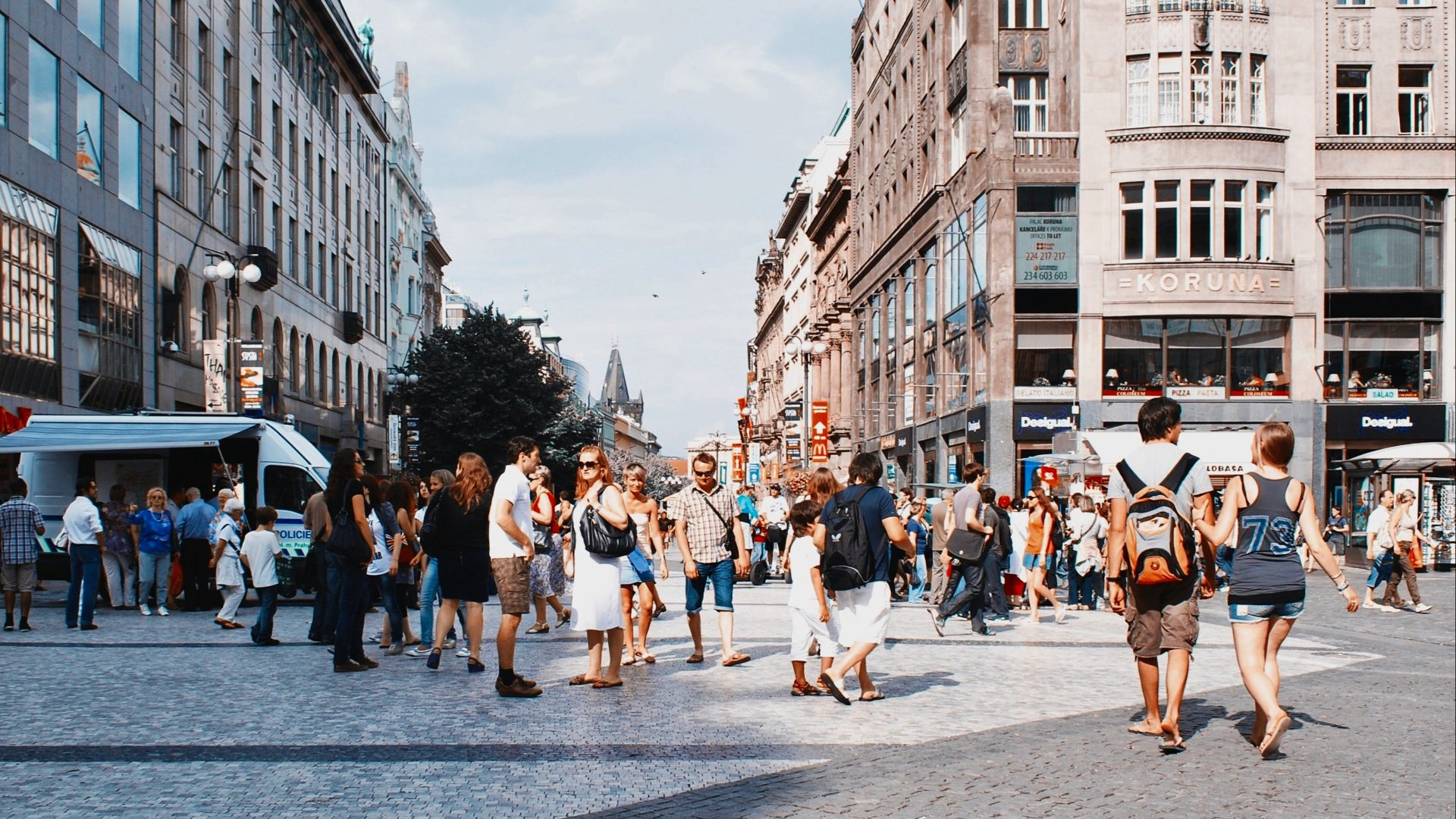 a group of people walking in a city