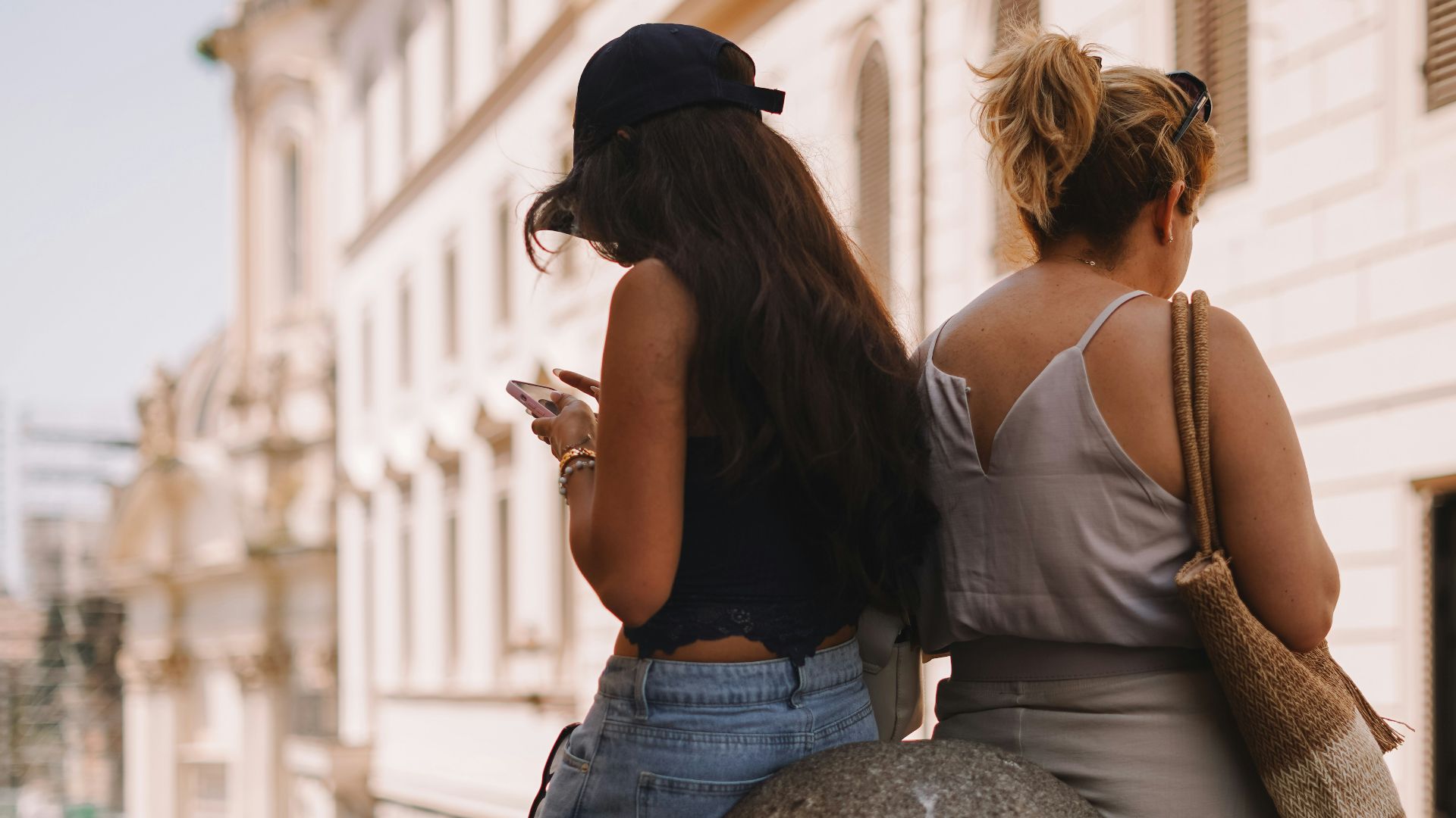 A couple of women standing next to each other