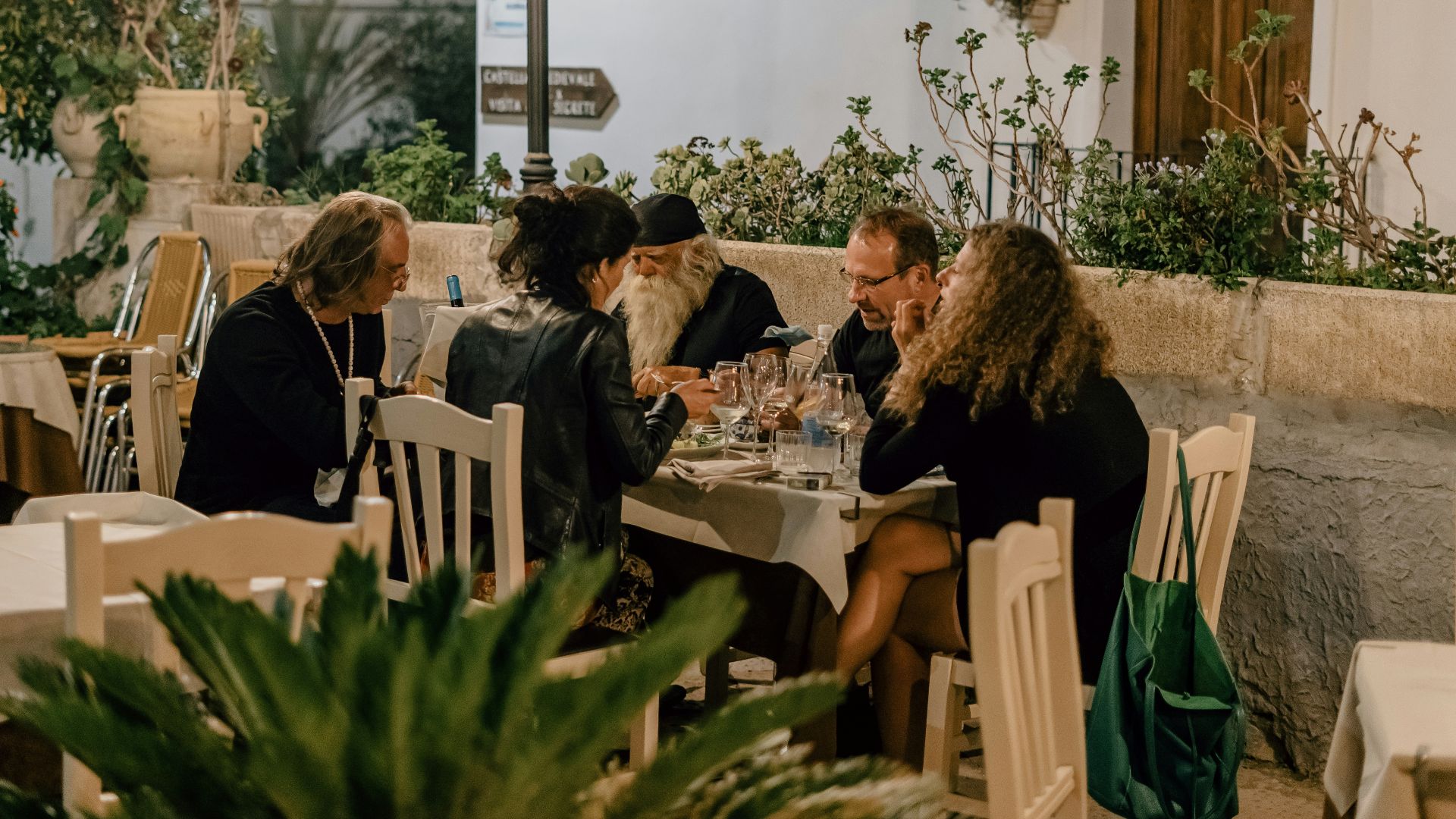 people sitting on chairs inside restaurant
