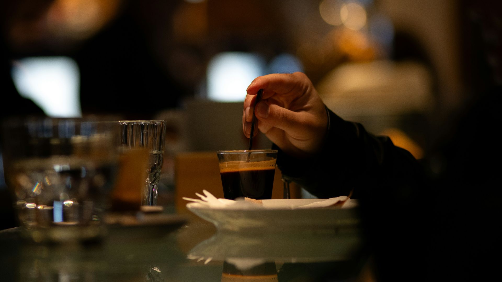 A person sitting at a table with a plate of food