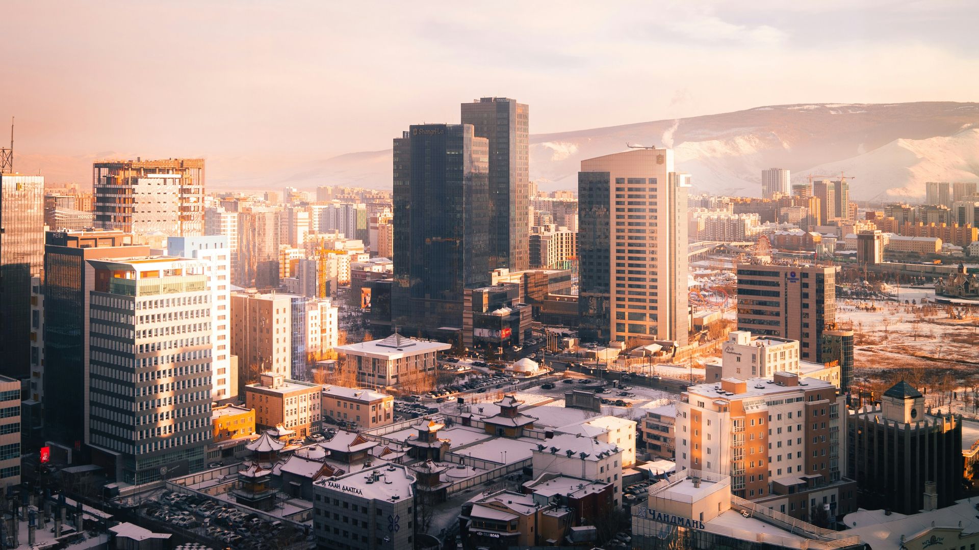 a view of a city with tall buildings