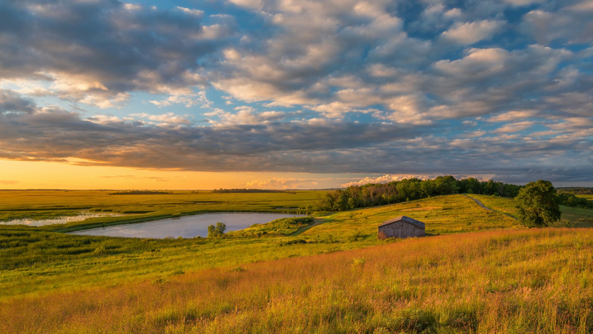 a small house on a grassy hill