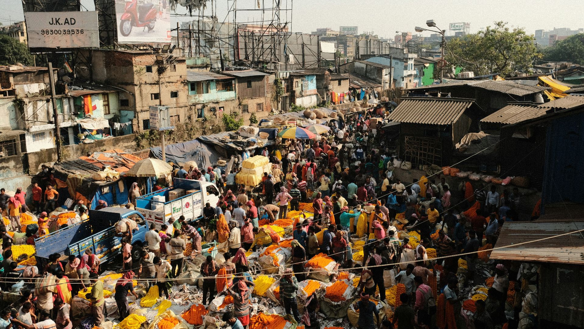 a large crowd of people in a slum area