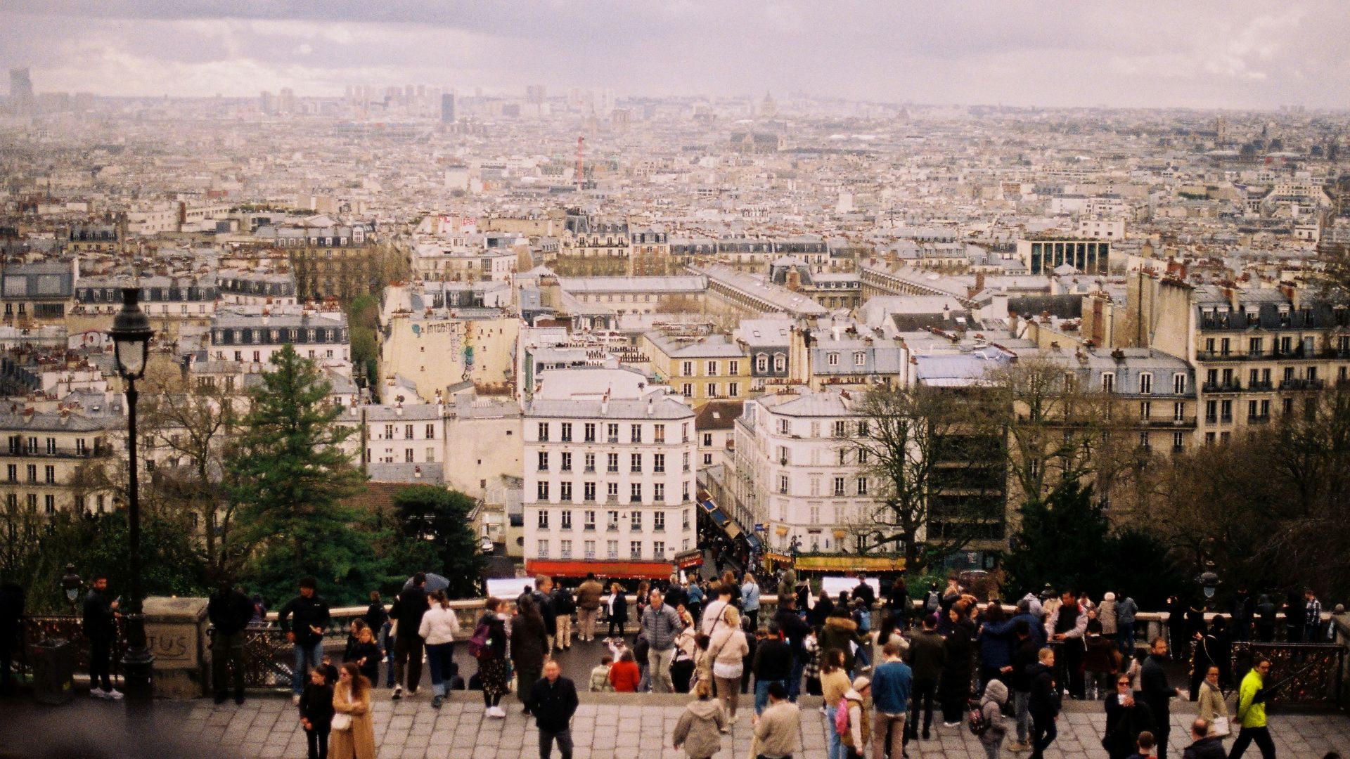 Overlooking a crowded cityscape on a cloudy day.