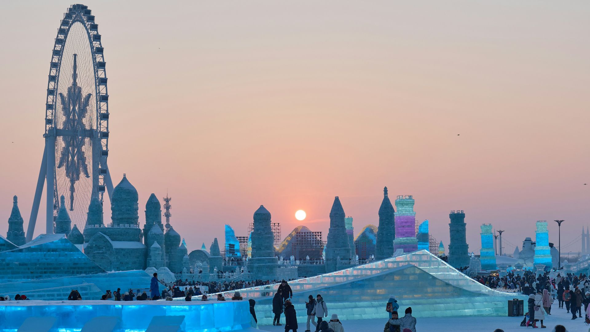 a group of people standing around an ice sculpture